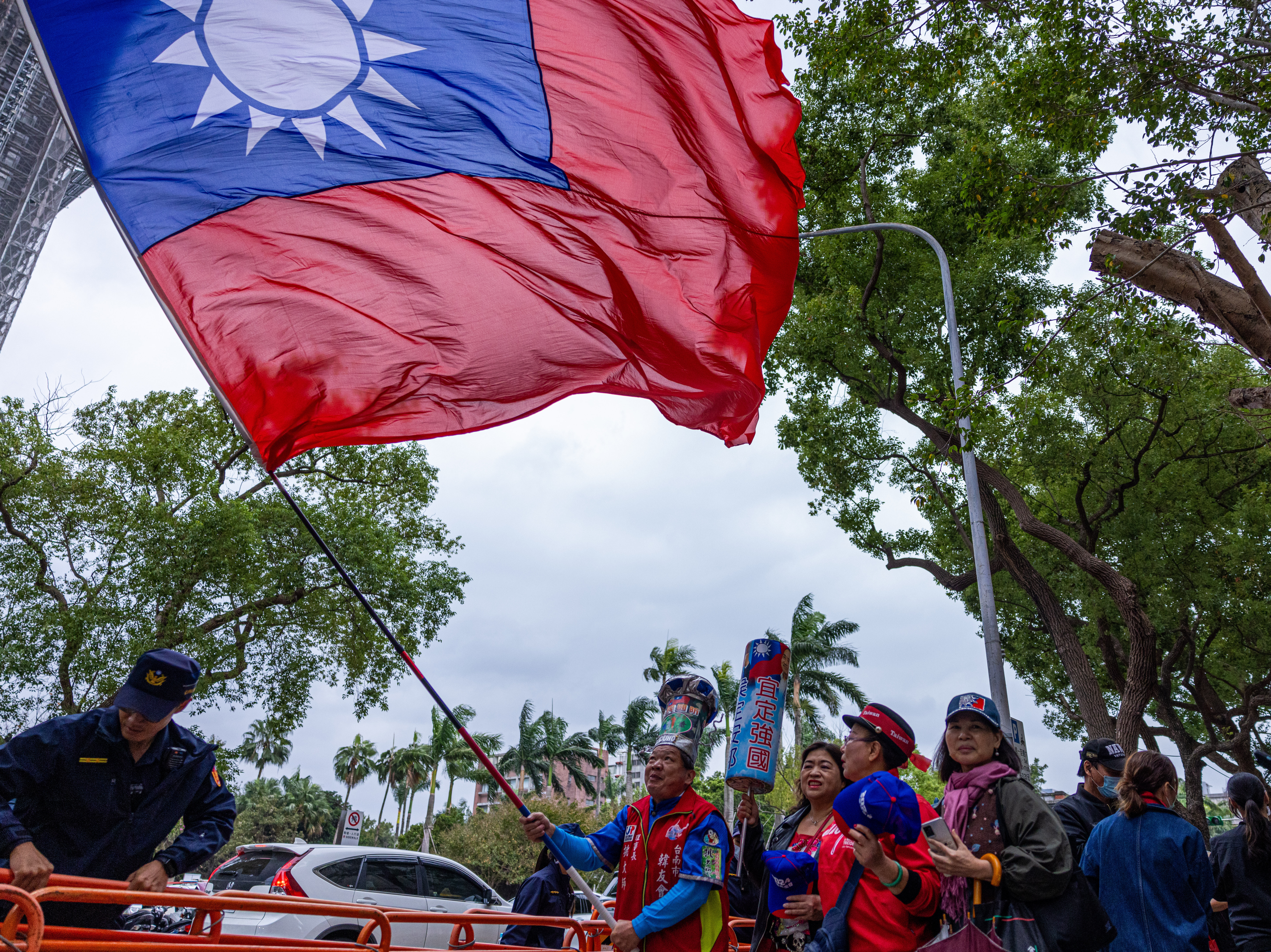 A supporter of Kuomintang, or KMT, Taiwan's major opposition party, waves Taiwan's national flag on Nov. 24, 2023, in Taipei, Taiwan. Researchers uncovered an influence operation targeting Taiwan's upcoming presidential election on Facebook, TikTok and YouTube. (Getty Images)