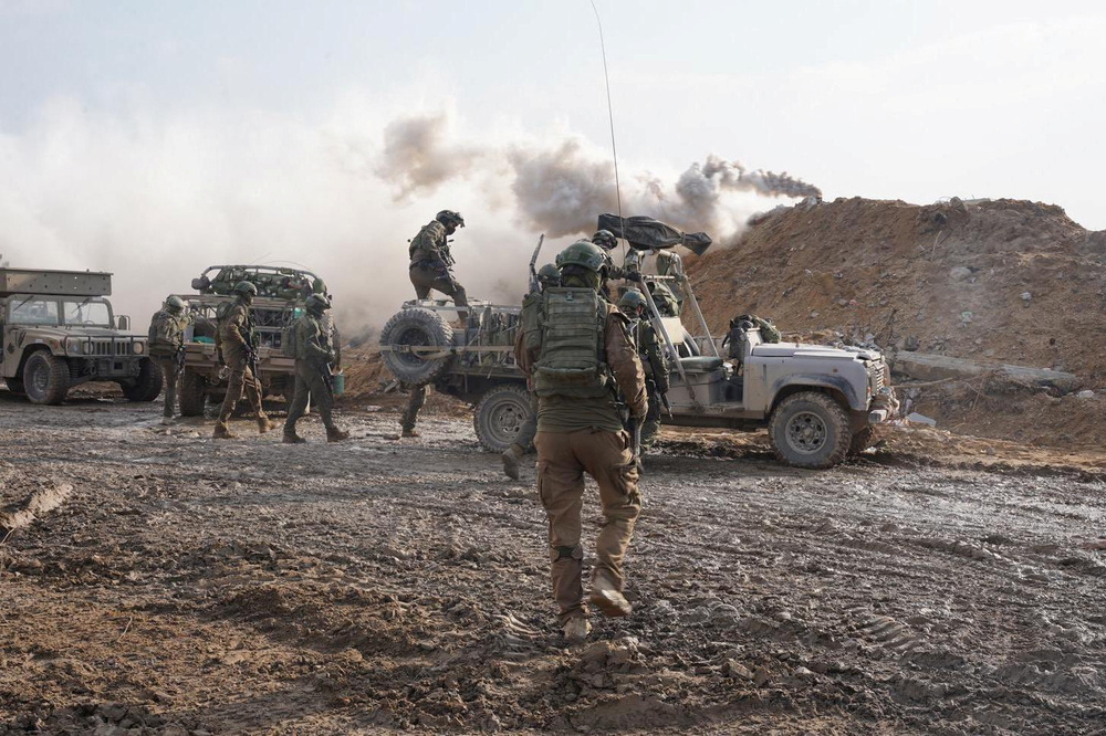 Israeli soldiers operate in the Gaza Strip amid the ongoing conflict between Israel and the Palestinian Islamist group Hamas, in this handout picture released on Thursday. (via Reuters)