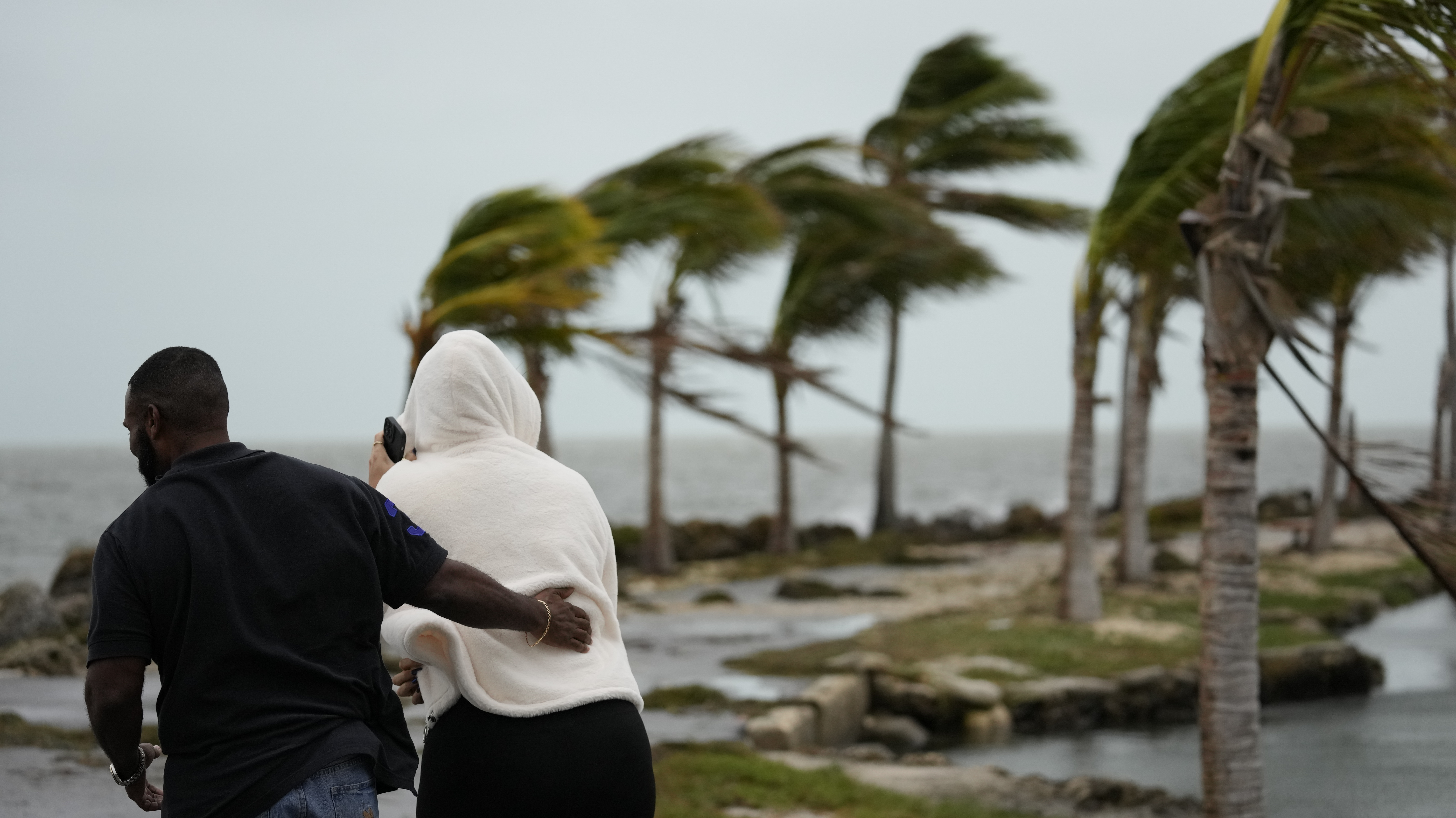 Storm system travels north from Florida, dumping rain across East Coast