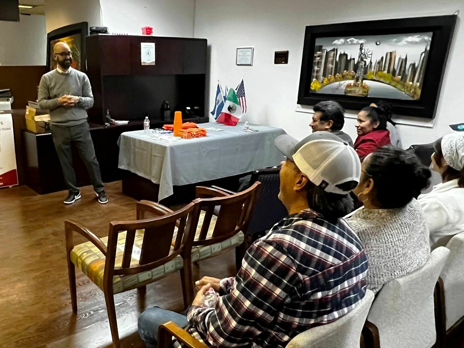 Haim Vasquez, an immigration attorney, talks to residents in Garland, Texas about new state border enforcement laws that will go into effect early next year. He says he wants immigrants to know their rights in case they get detained or arrested by law enforcement. (KERA)