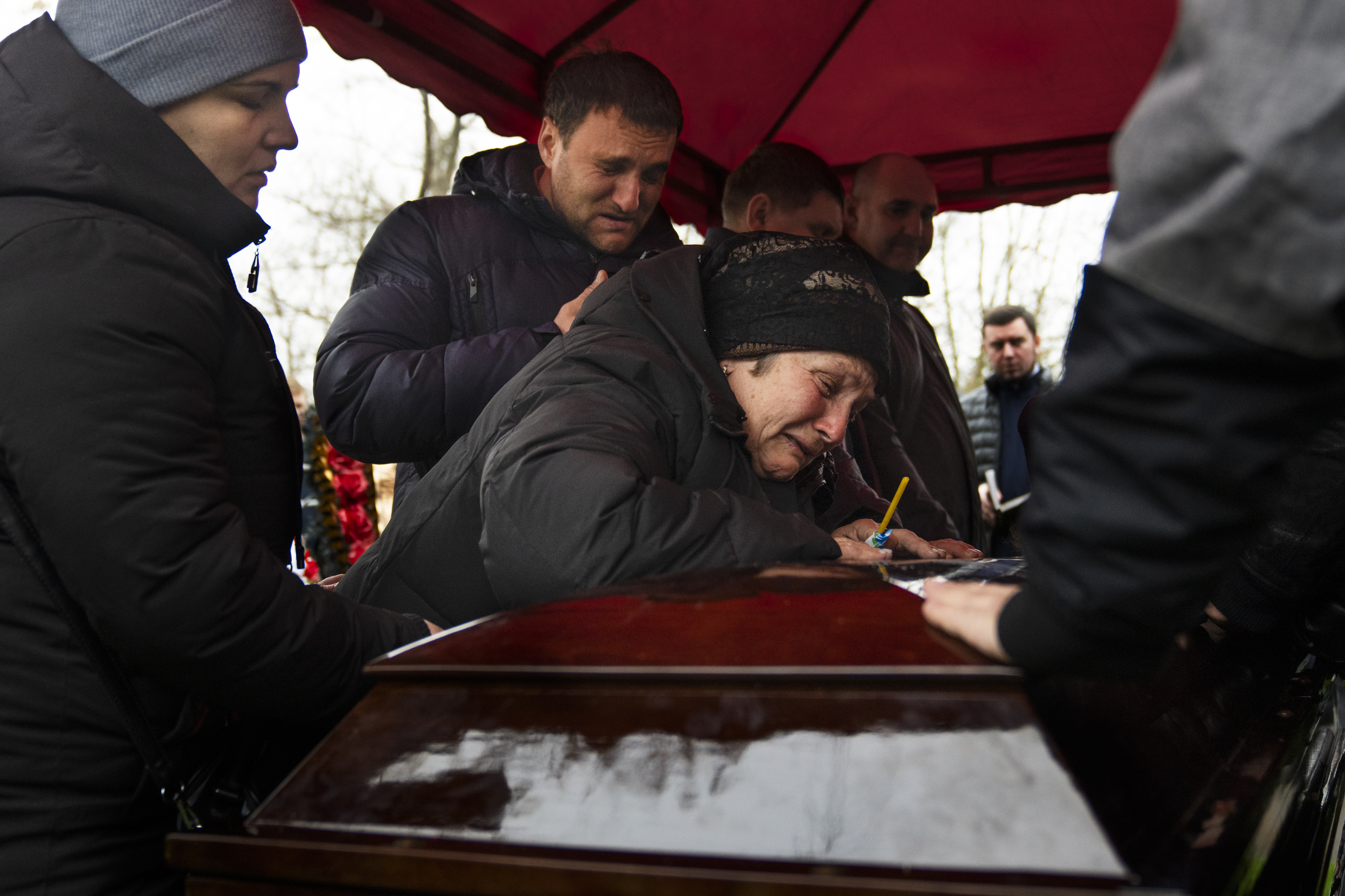 DNIPRO, UKRAINE — In a cemetery on the outskirts of the Ukrainian city of Dnipro, Mykhailo Korenovsky's mother sobs over his coffin at his funeral. Mourners gathered for the burial of Korenovsky, a boxing coach who was killed in a Russian missile strike on an apartment building. Click here for the full story.