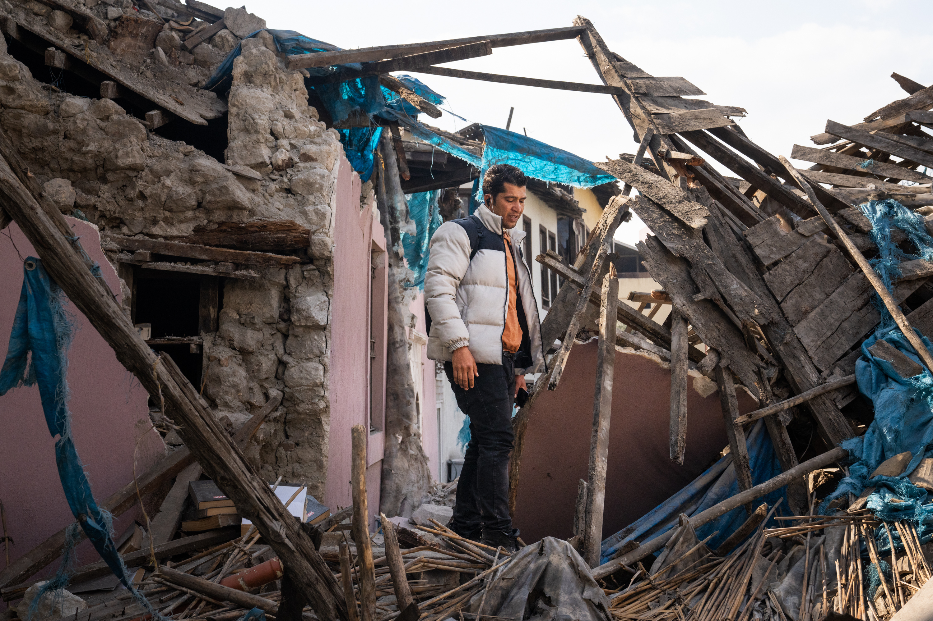 ANTAKYA, TURKEY — Yusuf Kocaoglu stands in the wreckage of buildings damaged by the earthquake in Antakya, Turkey, as he tries to walk through the city where he used to give history tours. Click here for the full story.