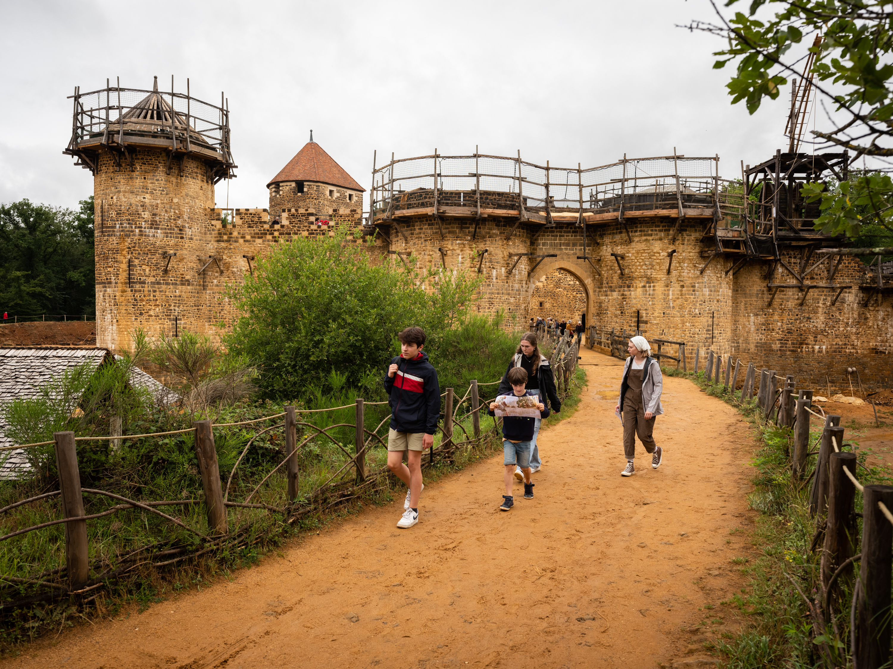 BURGUNDY, FRANCE — Visitors walk by as construction is afoot at Guédelon castle, in France's northern Burgundy region, where builders and crafts people are using tools and methods from the Middle Ages. Click here for the full story.