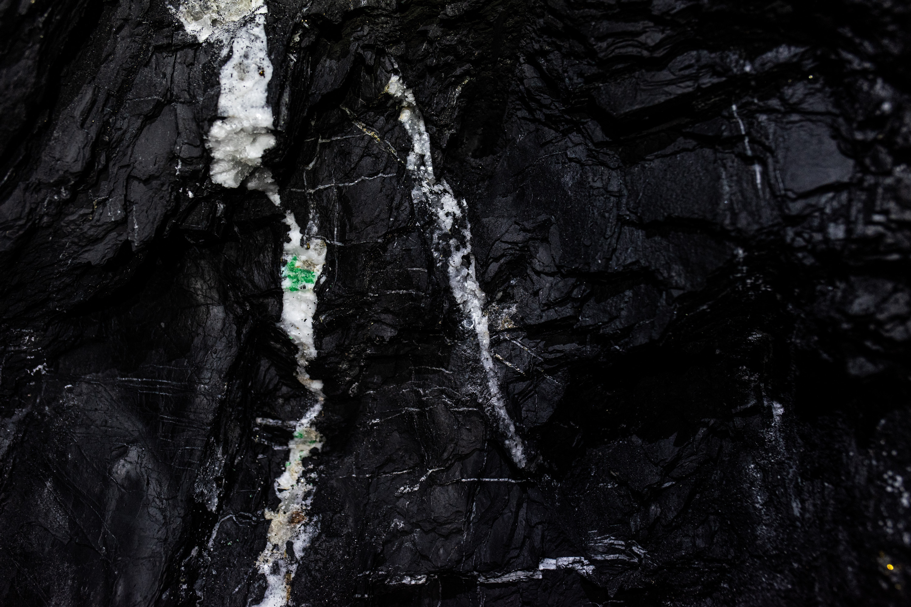 MUZO, COLOMBIA — Emeralds encrusted in white calcite rock inside the mine at Muzo in central Colombia. They will later be analyzed at a laboratory to determine their worth. Click here for the full story.