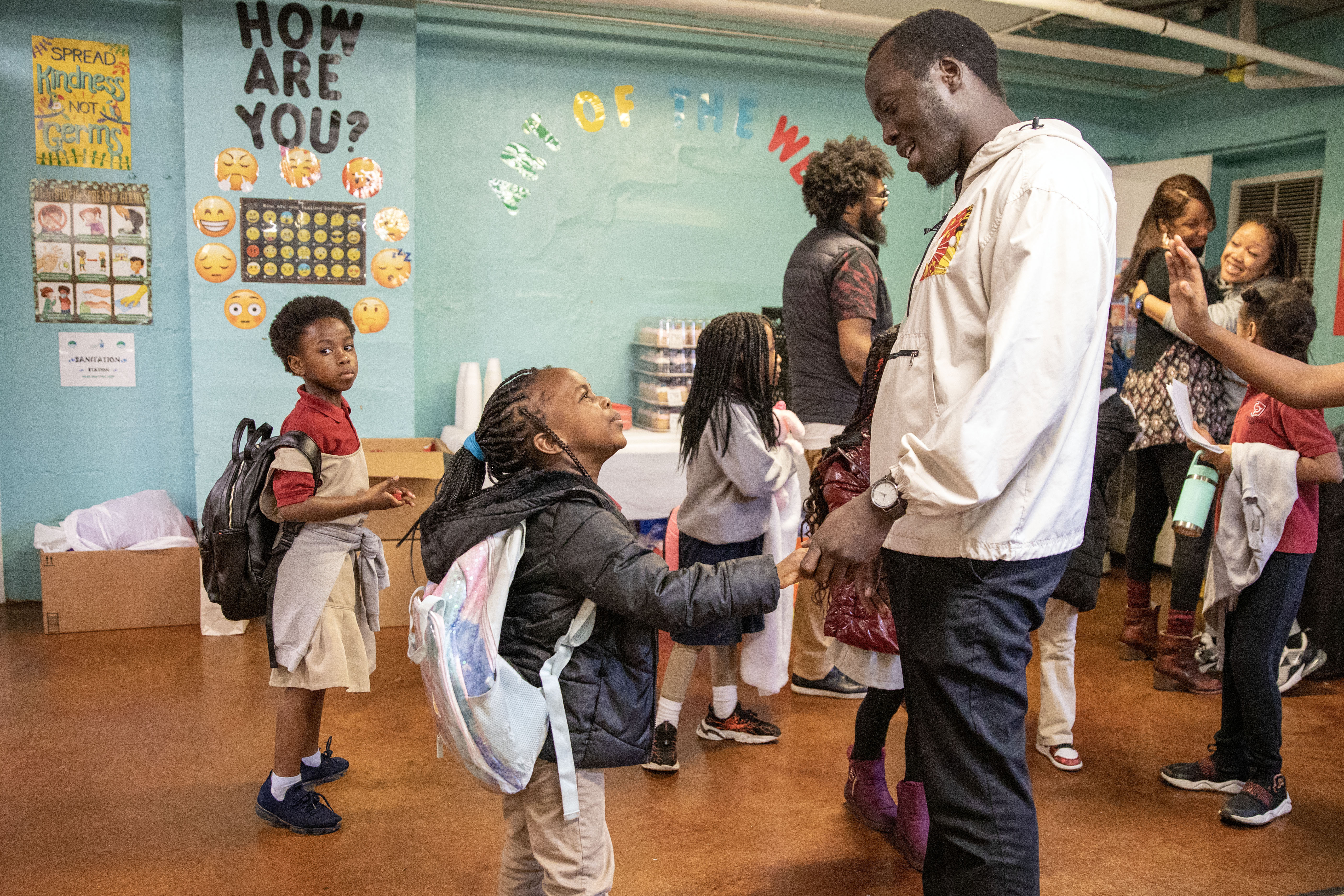 MEMPHIS: Director of Diversity, Equity and Inclusion Isaac James greets children at the Memphis Refugee Empowerment Program on Feb. 15. See the story.