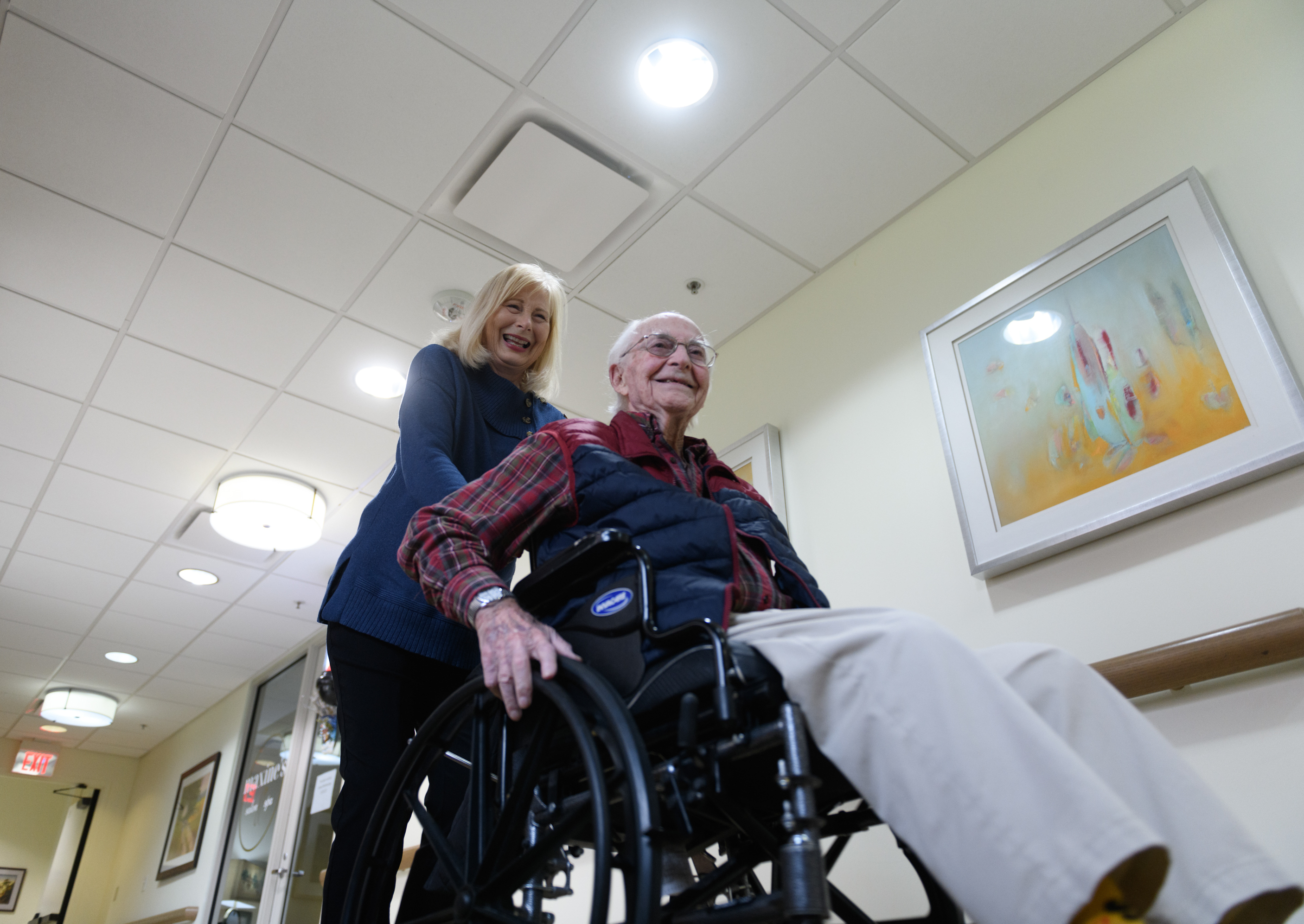 TULSA, OKLA.: Paula Naylor pushes her father, Paul Romanello, with his wheelchair on Dec. 21 Romanello was recently celebrated by the Centenarians of Oklahoma when he turned 100 years old. See the story.