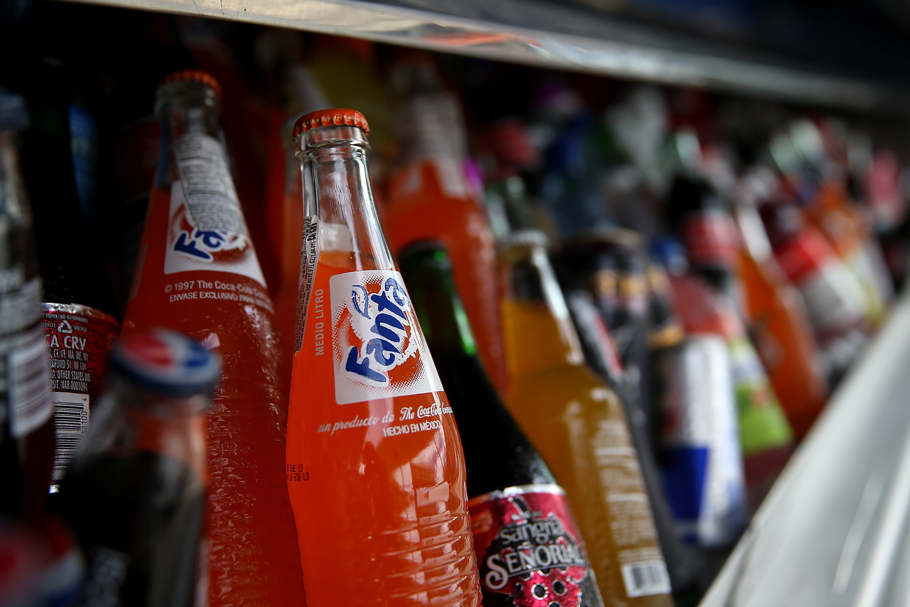 Five U.S. cities which imposed taxes on sugary drinks saw prices rise and sales fall by 33%, according to a new study. (Getty Images)