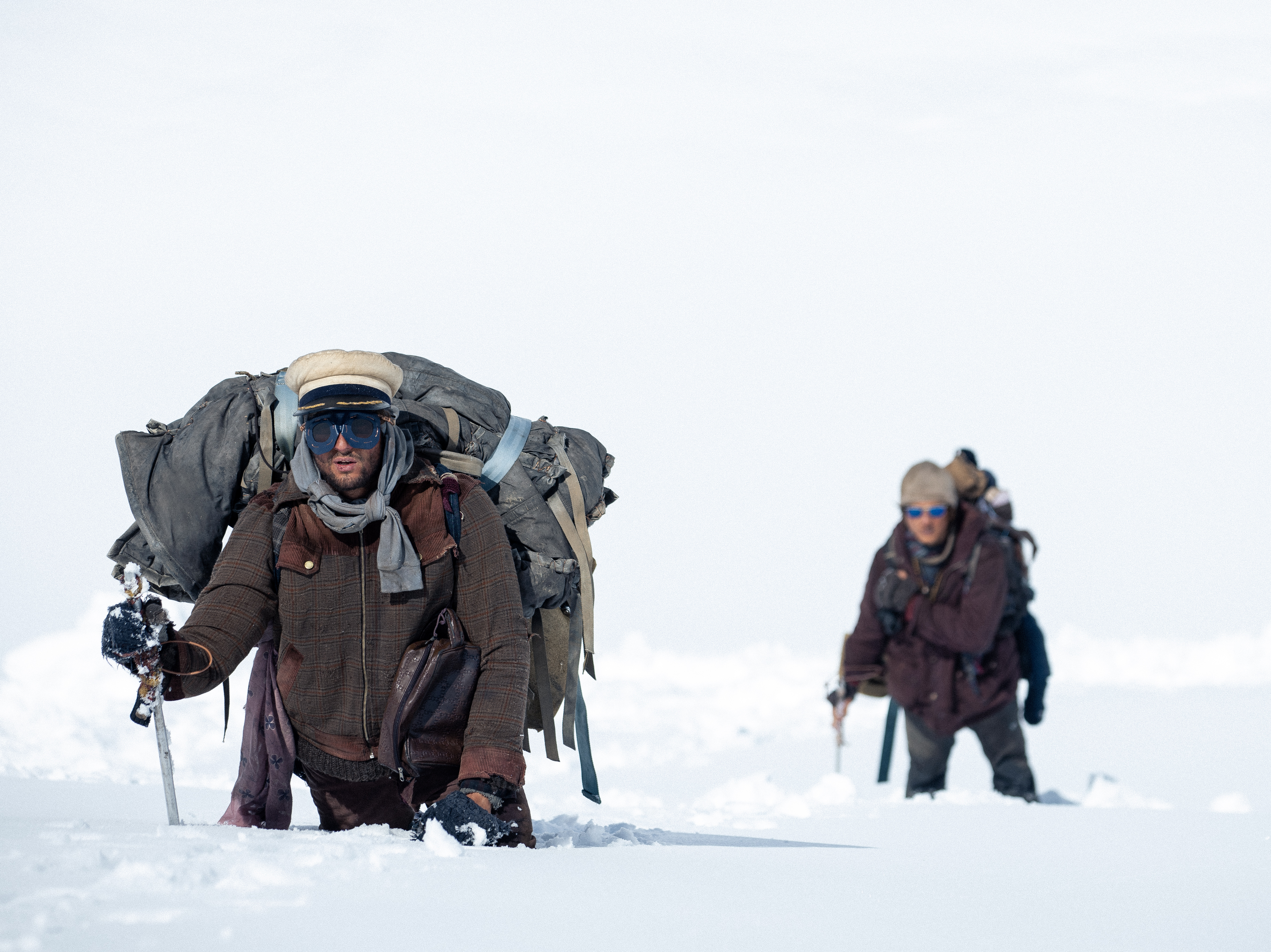 They crashed in the mountains and turned to cannibalism. He focuses on the humanity
