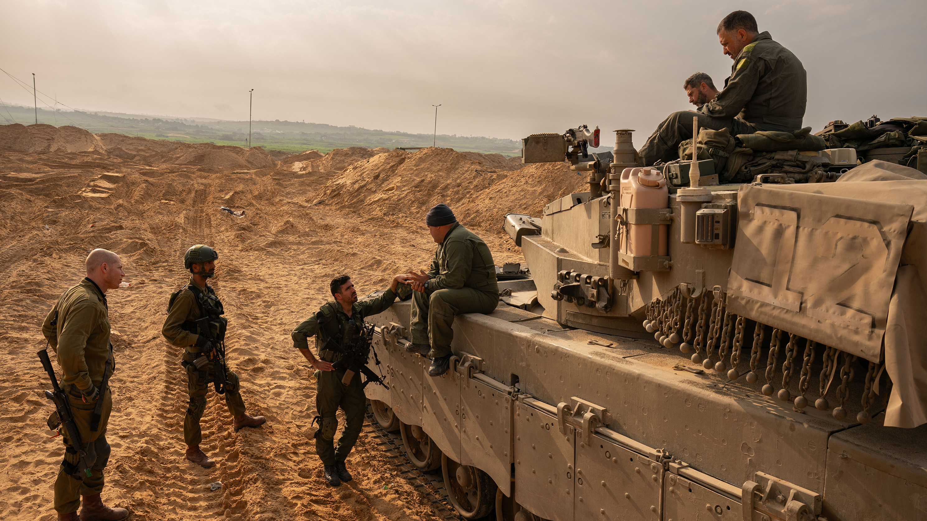 Israeli soldiers and artillery in southern Israel by the border with the Gaza Strip, on Dec. 27.