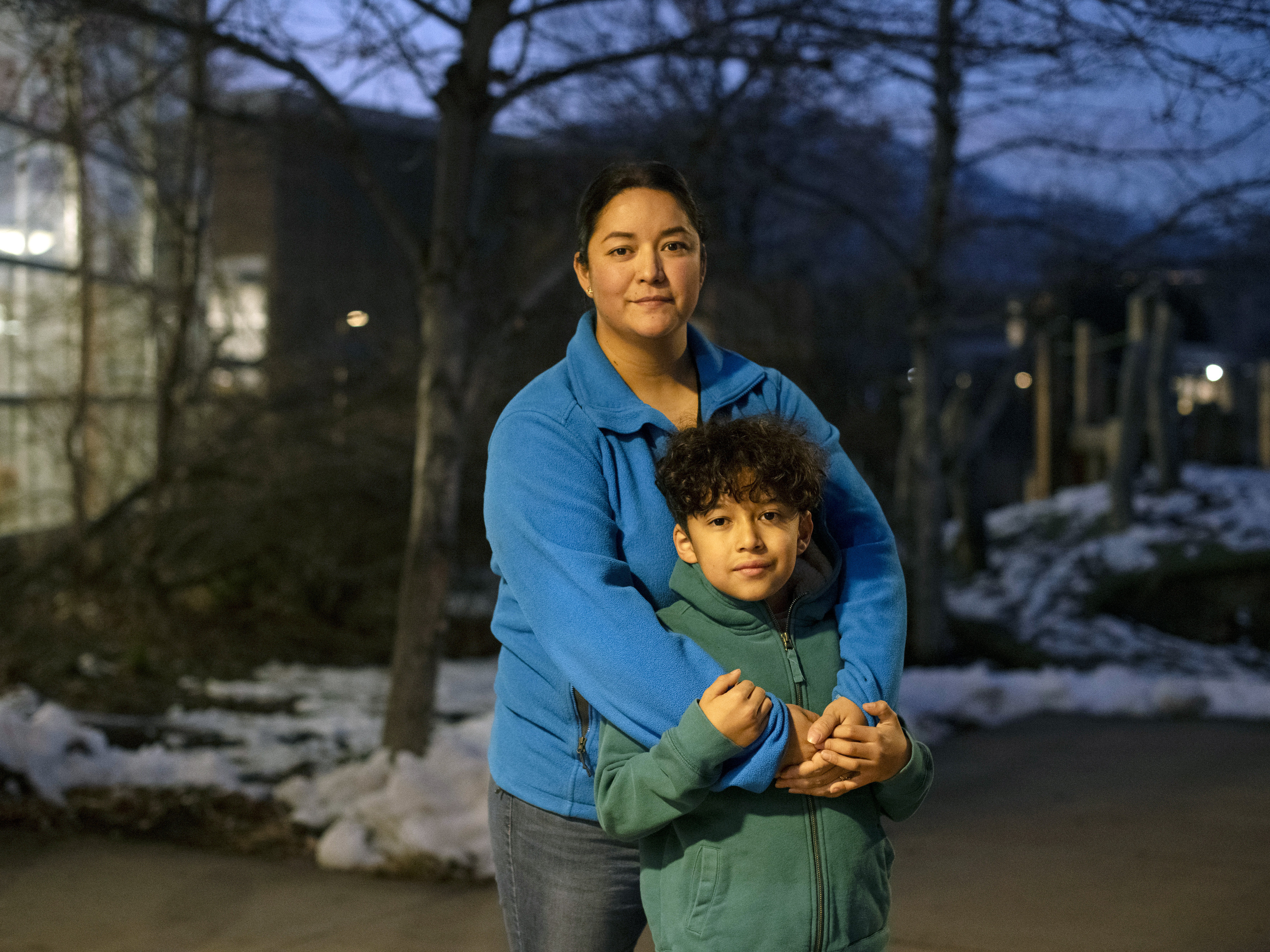 Maribel Martinez and her son, Ivan Monreal-Martinez, 9, at the Boulder Public Library on the night of the December coupon distribution for the Fruit & Veg program. (Rachel Woolf for NPR)