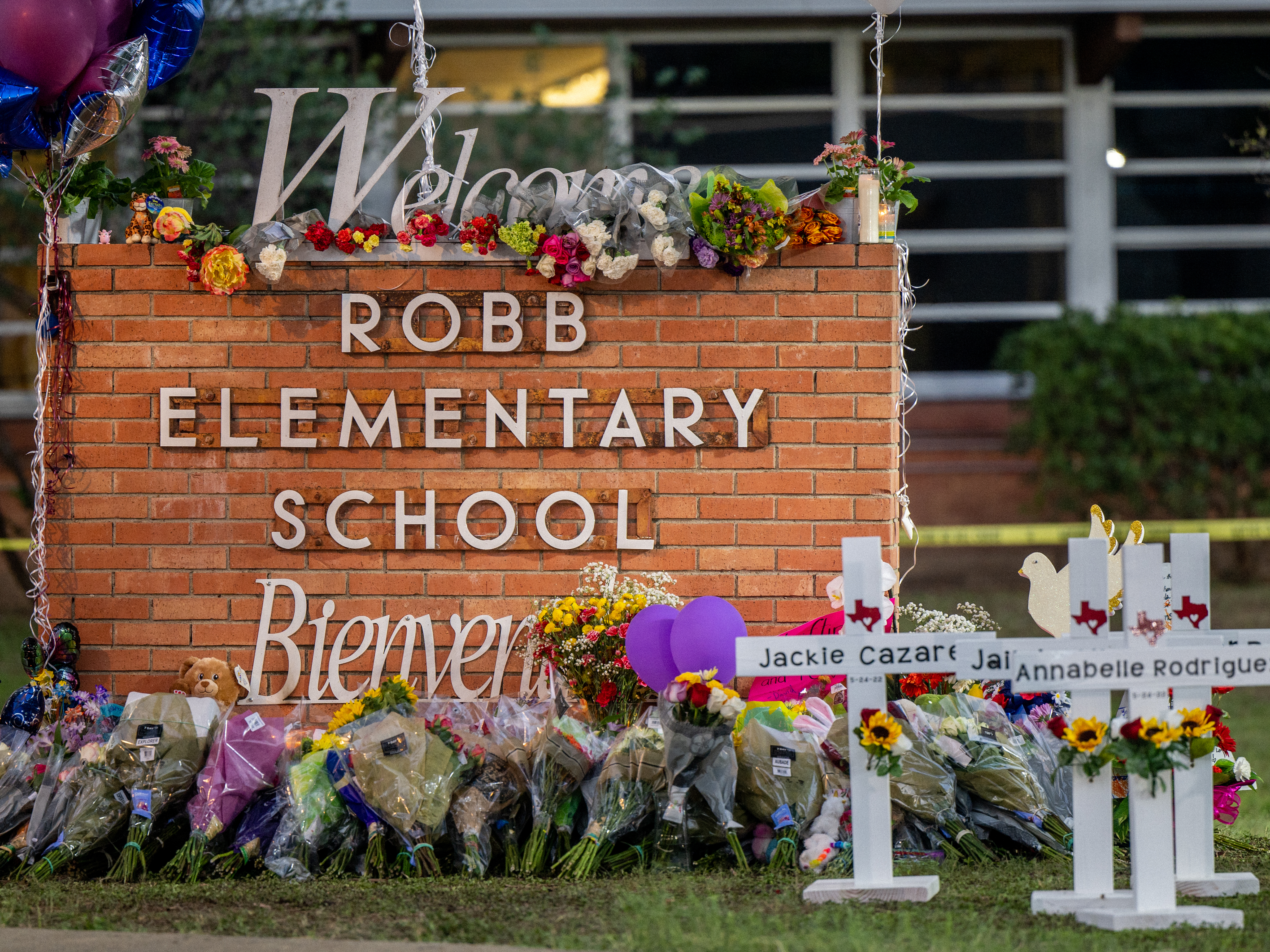 A memorial is seen surrounding the Robb Elementary School sign following the mass shooting at Robb Elementary School on May 26, 2022 in Uvalde, Texas. (Brandon Bell/Getty Images)