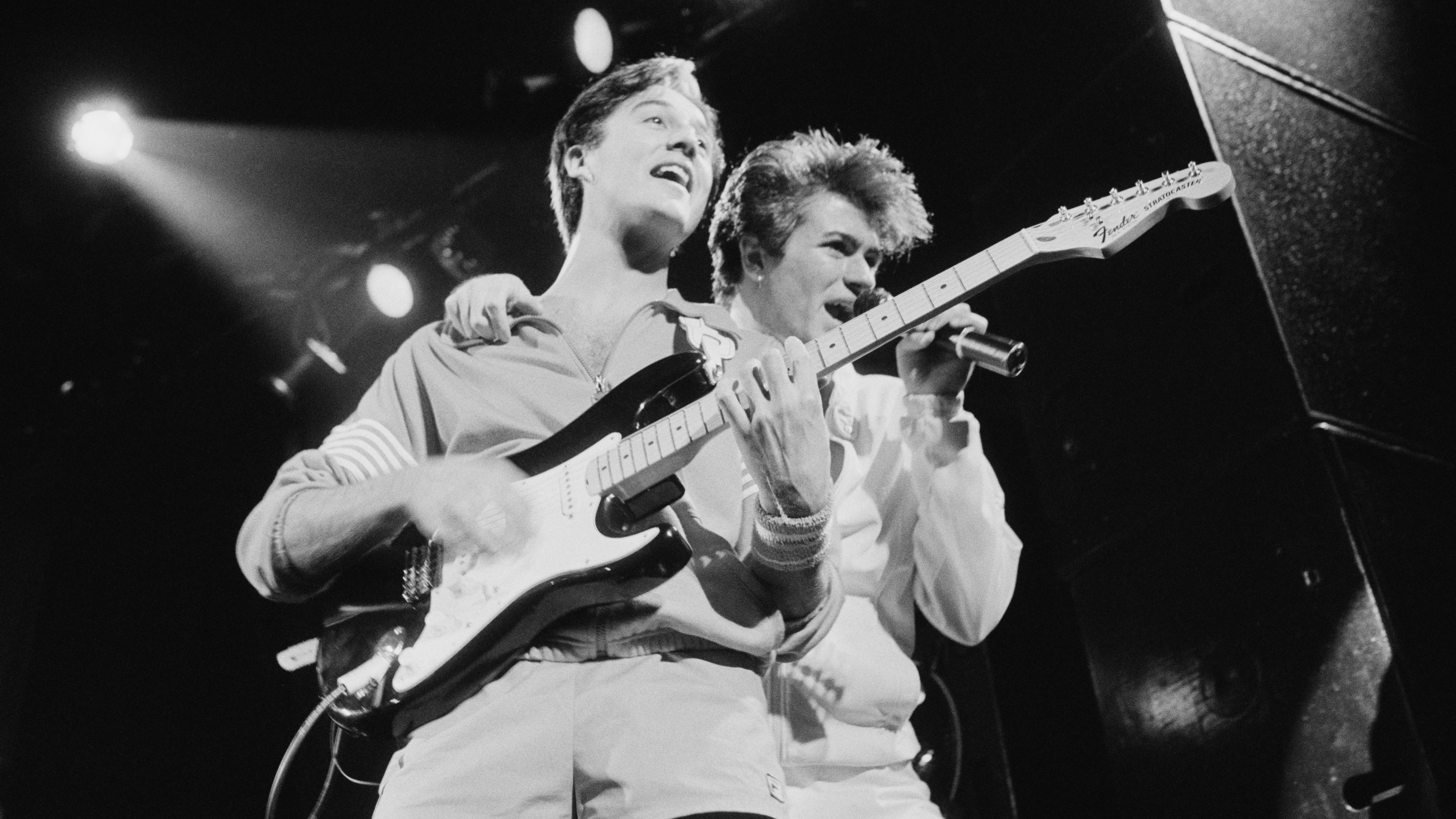 Andrew Ridgeley and George Michael of pop duo Wham! perform in London in November 1983.