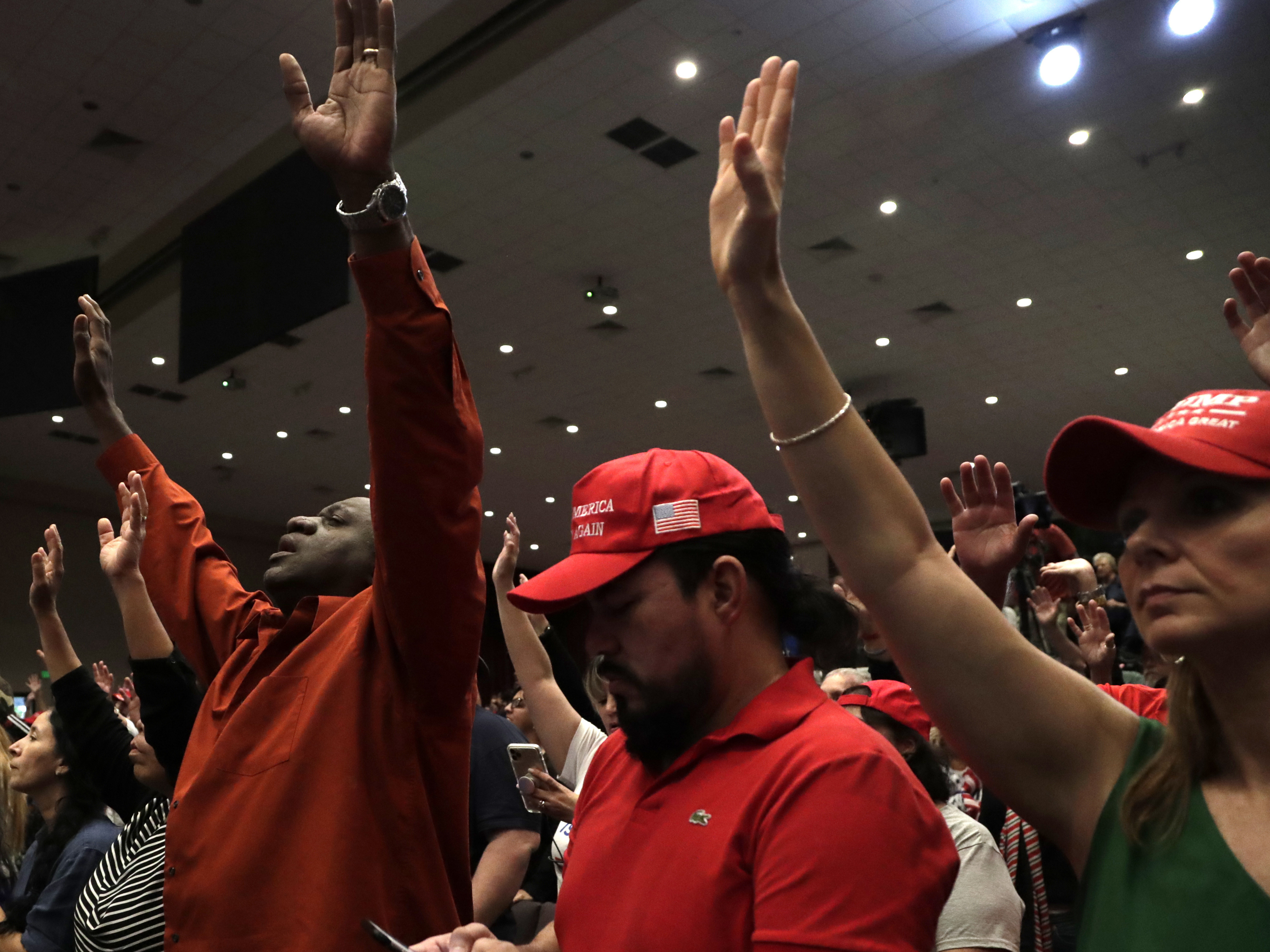 In this file photo from 2020, People raise their arms in prayer during a rally for evangelical supporters of President Donald Trump at the King Jesus International Ministry church, Friday, Jan. 3, 2020, in Miami.