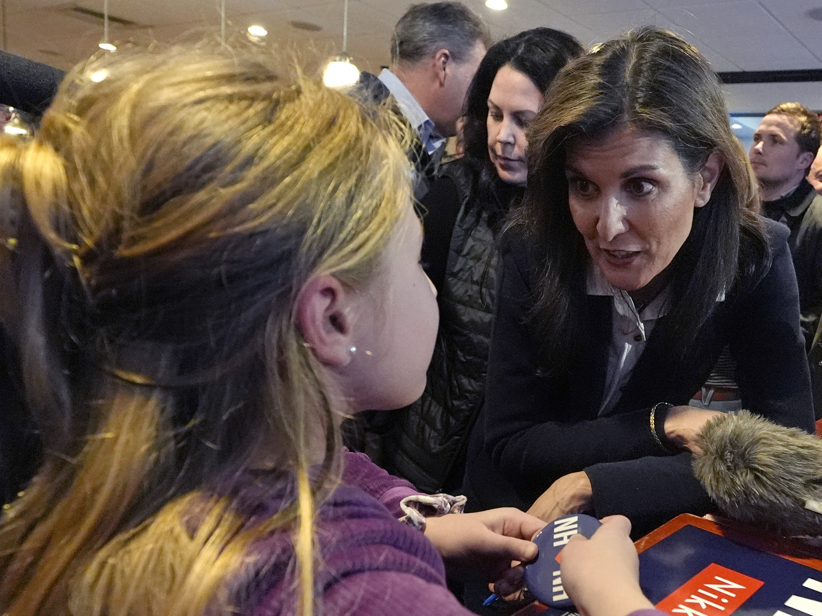 Republican presidential candidate former UN Ambassador Nikki Haley chats with 10-year-old Hadley Craig during a campaign stop on Jan. 19 in Milford, N.H.