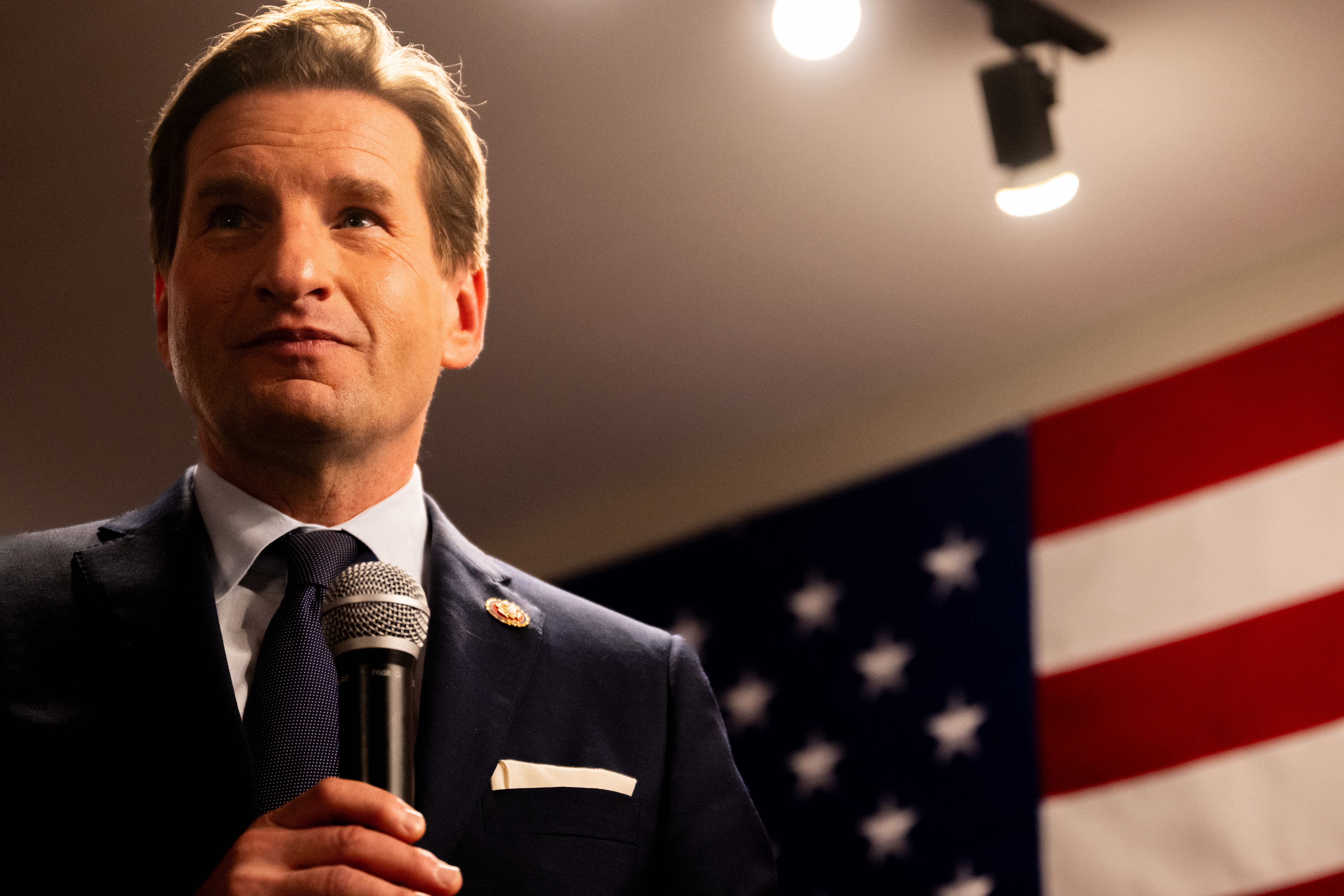 Democratic challenger and U.S. Rep. Dean Phillips listens to supporters during a campaign rally on Jan. 22 in Manchester, N.H. (Getty Images)