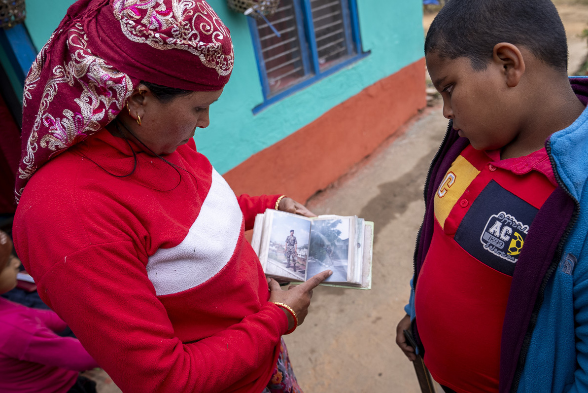 Nepal wants its men back from Russia's war in Ukraine after deaths on the front 3 Reema Karki and her son look at images of her husband, Pritam Karki, who died on Nov. 15 while serving in the Russian military in Ukraine.