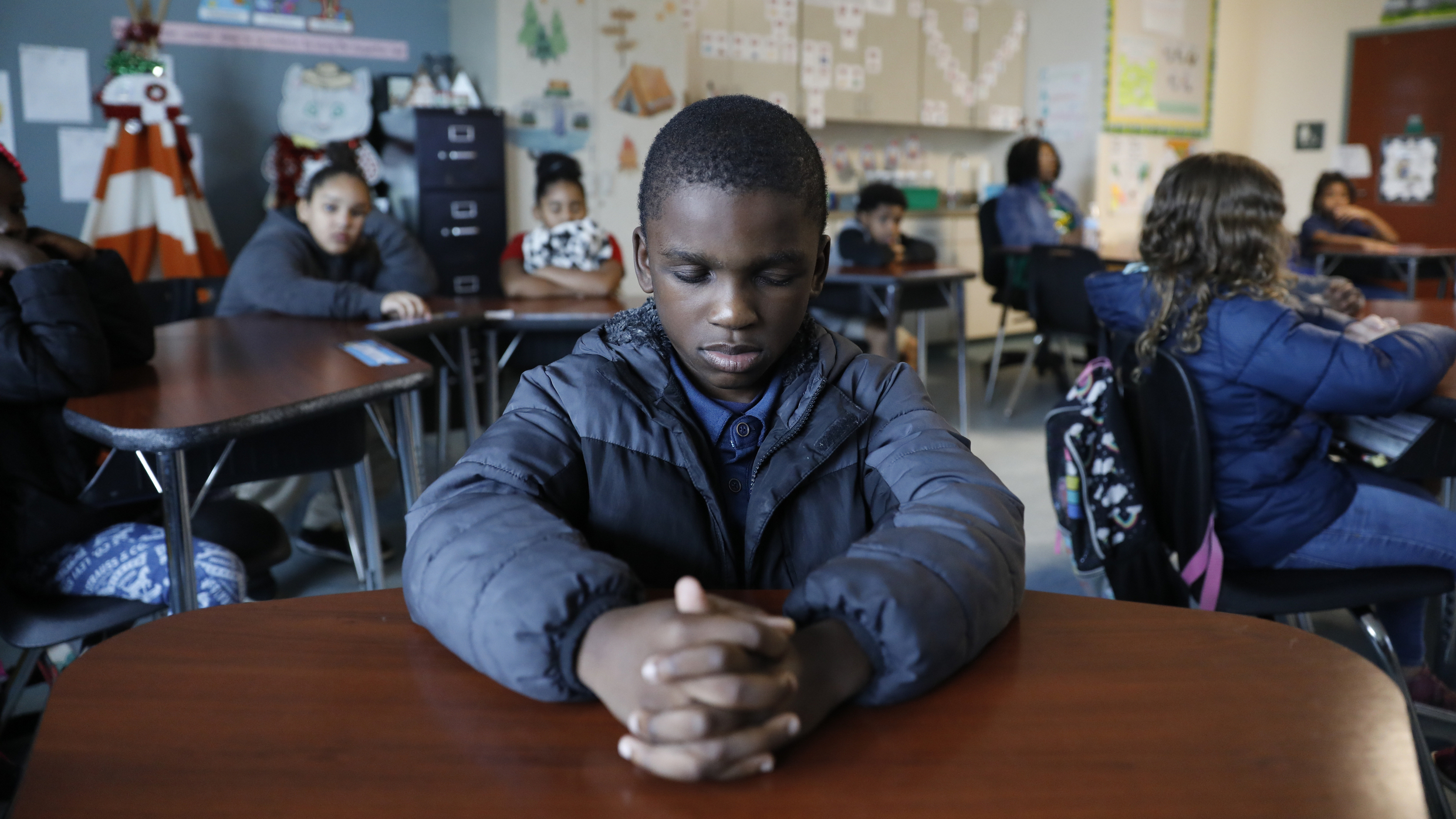 To help these school kids deal with trauma, mindfulness lessons over the loudspeaker