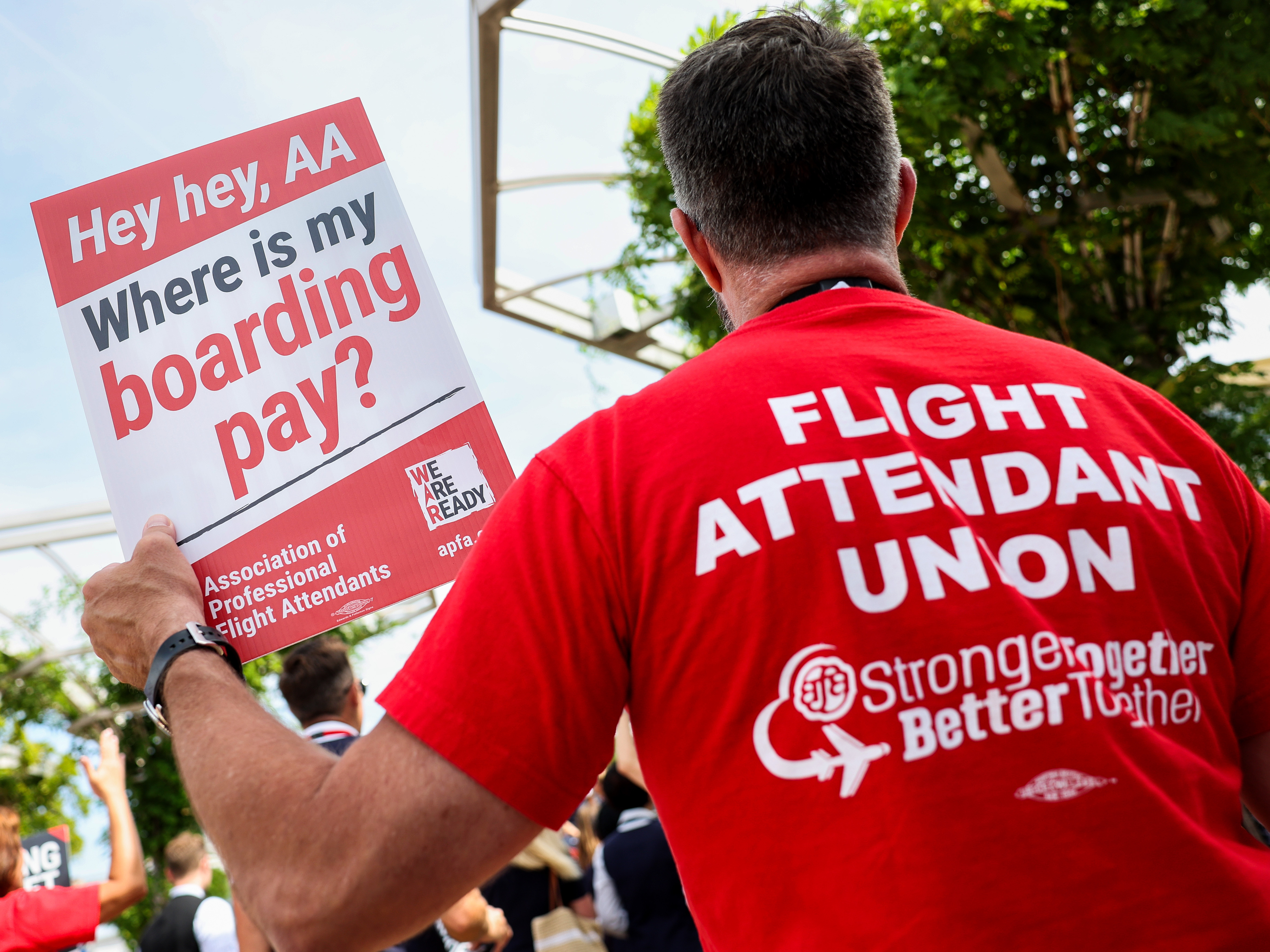 American Airlines flight attendants, represented by the Association of Professional Flight Attendants (APFA), picket outside Ronald Reagan National Airport last August in Arlington, Va. (Getty Images)