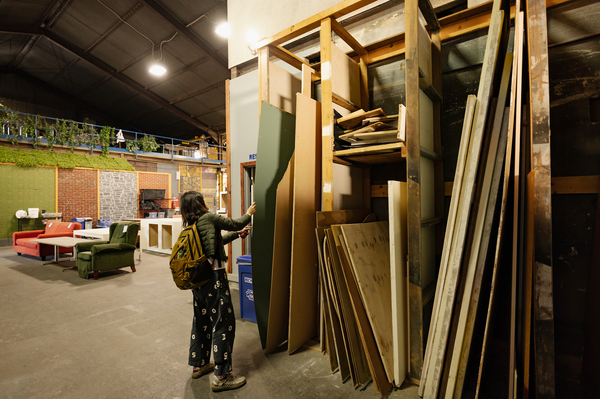 Liao shops for materials in EcoSet's aisles. When sets get too old to rent out to big-budget productions, they often wind up at places like the Los Angeles-based company.