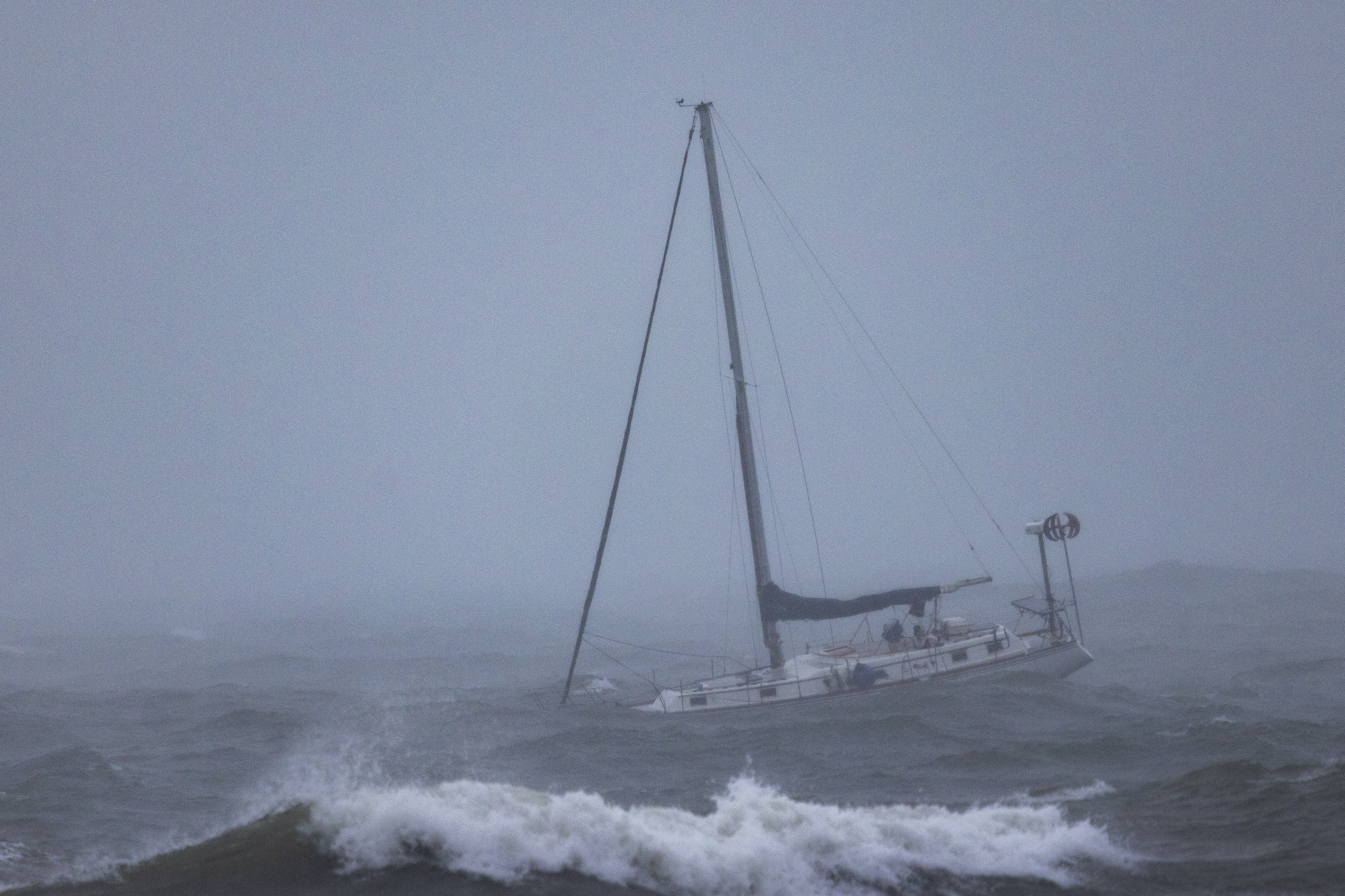 Santa Barbara: A boat moored offshore is tossed by rough waters as the second and more powerful of two atmospheric river storms arrives Sunday. The West Coast was getting drenched on Feb. 1 as the first of two powerful storms moved in, part of a "Pineapple Express" weather pattern that was washing out roads and sparking flood warnings.