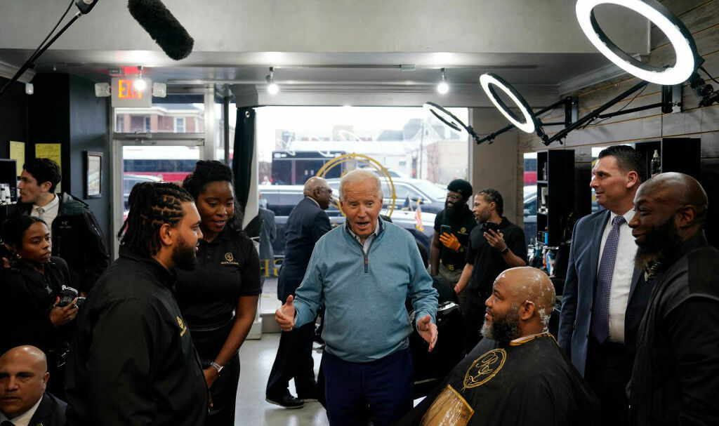 President Biden greets staff and patrons at Regal Lounge, a Men's Barber & Spa, in Columbia, S.C., before speaking at a political event in the area on Jan. 27. (AFP via Getty Images)
