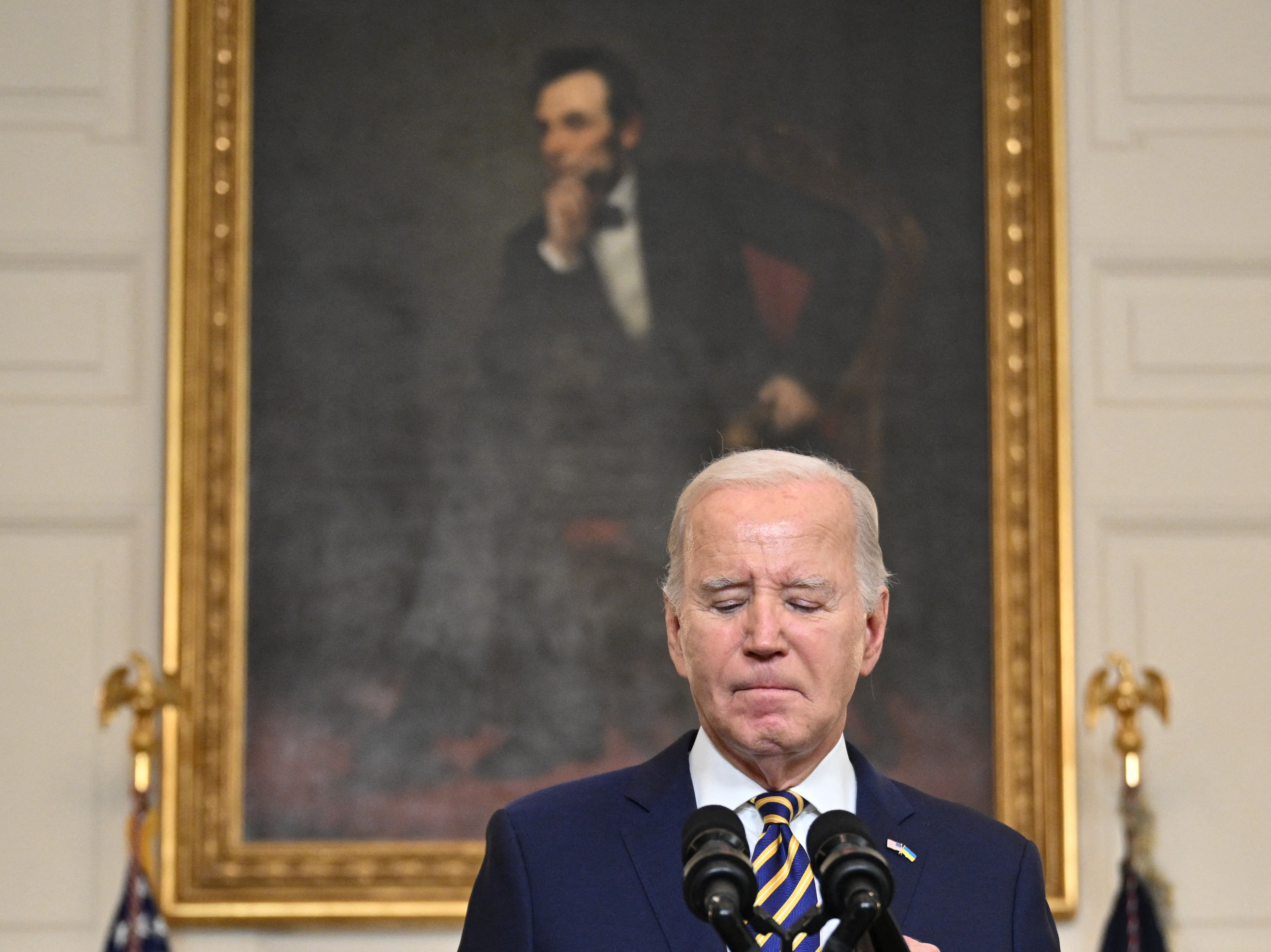 President Biden pauses in remarks in the State Dining Room on Feb. 6. Biden urged Congress to pass a Senate compromise bill with funding for the border, Ukraine and other national security priorities. (AFP via Getty Images)