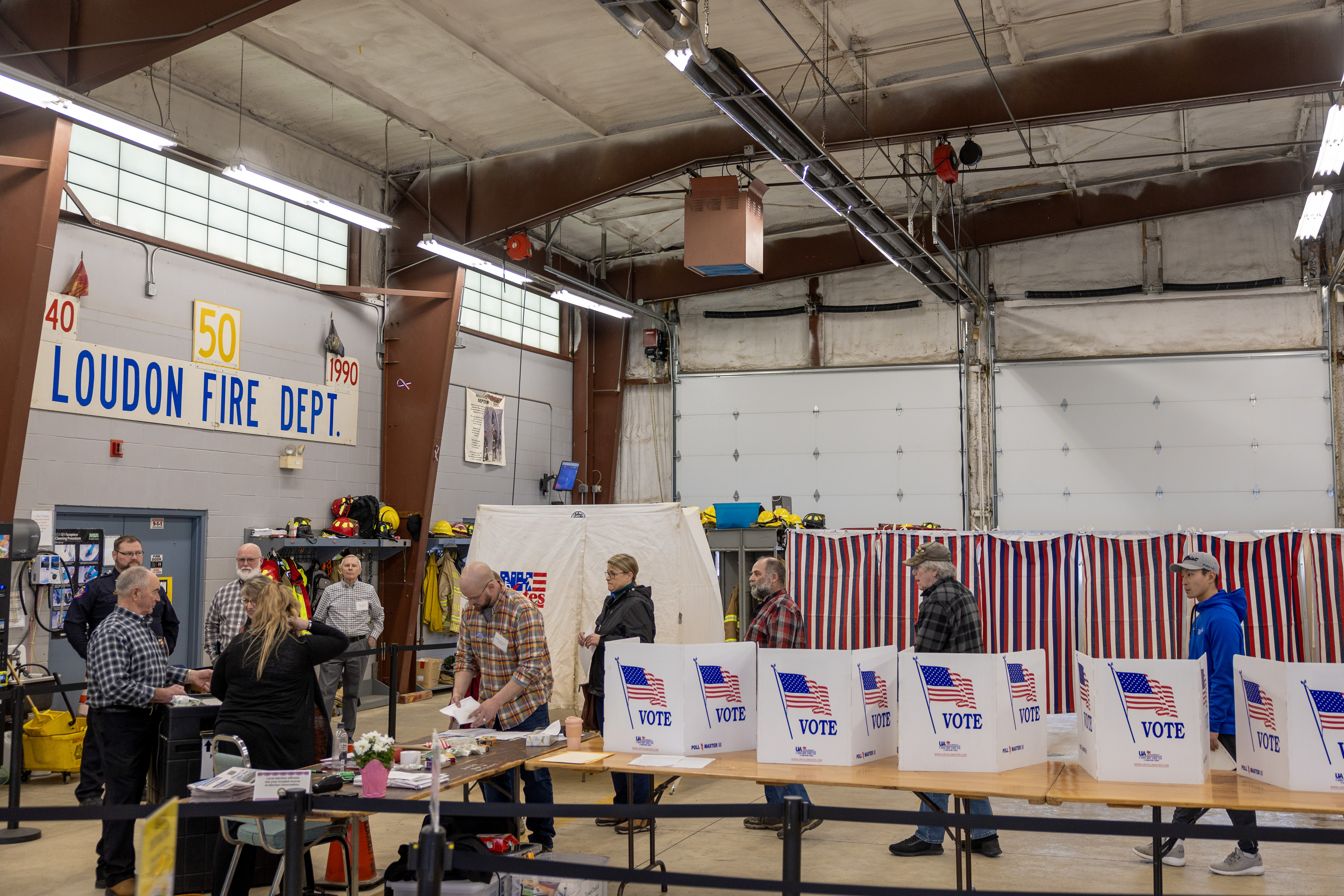 Voters wait to cast their ballots on Jan. 23 in Loudon, N.H. Shortly before voting began, some voters in the state got calls from a faked version of President Biden's voice urging them not to vote, a sign of the potential that deepfakes could have on the electoral process. (Getty Images)