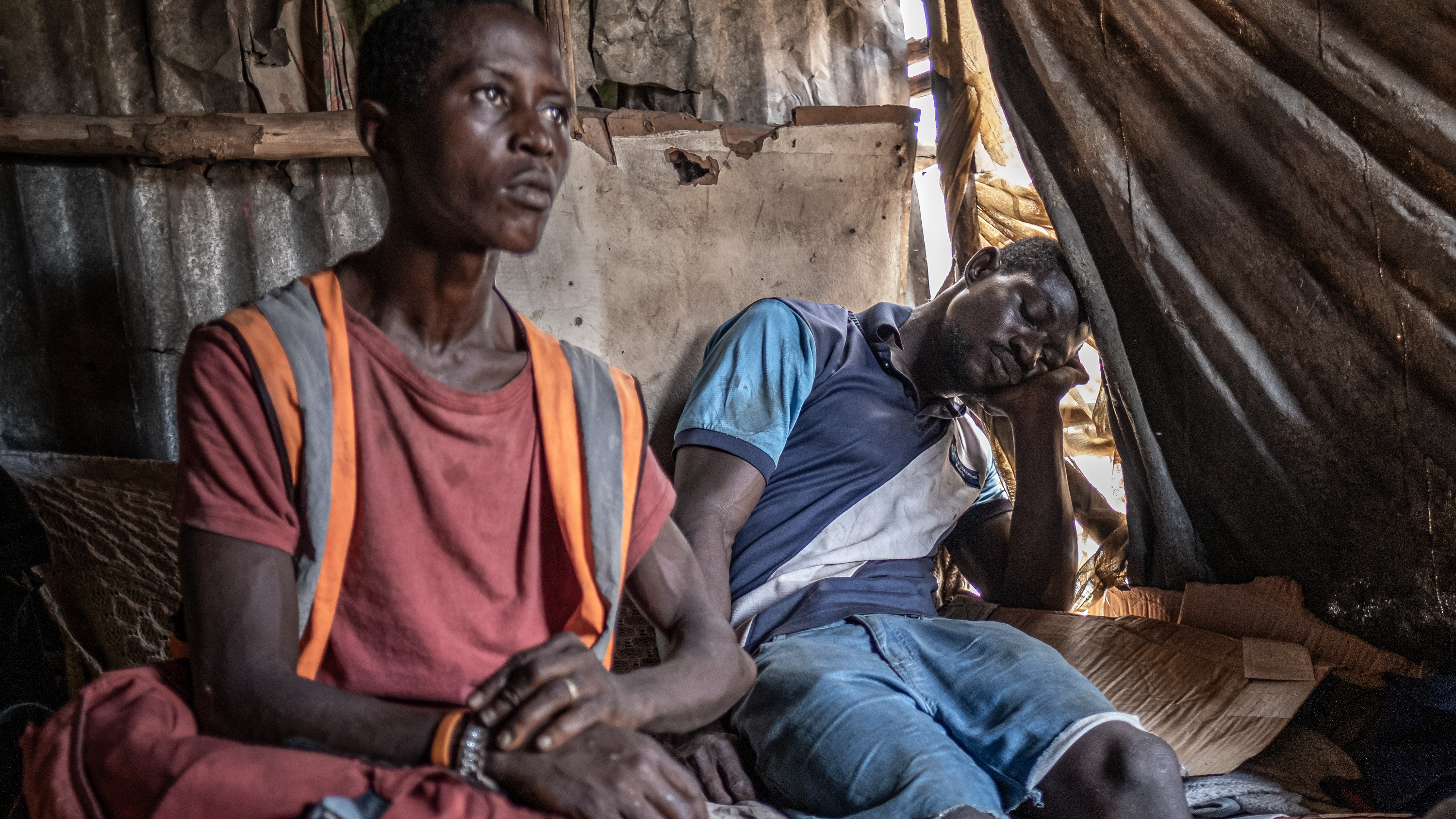 Kush users in a shack at the Kingtom dumpsite in Freetown, Sierra Leone. Cheap, quick to take effect and easily accessible, kush has proved dangerously appealing to a generation of young Sierra Leoneans growing up amid widespread poverty and unemployment.