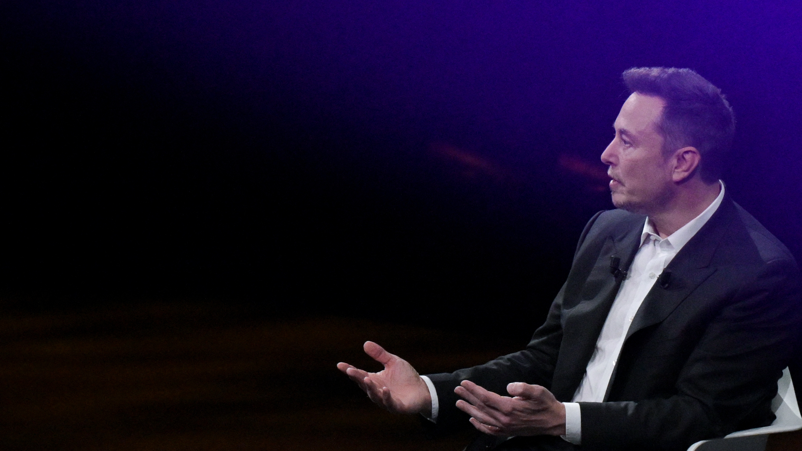 Tesla CEO Elon Musk speaks at a conference in Paris on June 16, 2023. Musk's record compensation package as Tesla CEO was recently rejected by a court as excessive, in a decision that pivoted in part on how much sway Musk has over his company. (AFP via Getty Images)