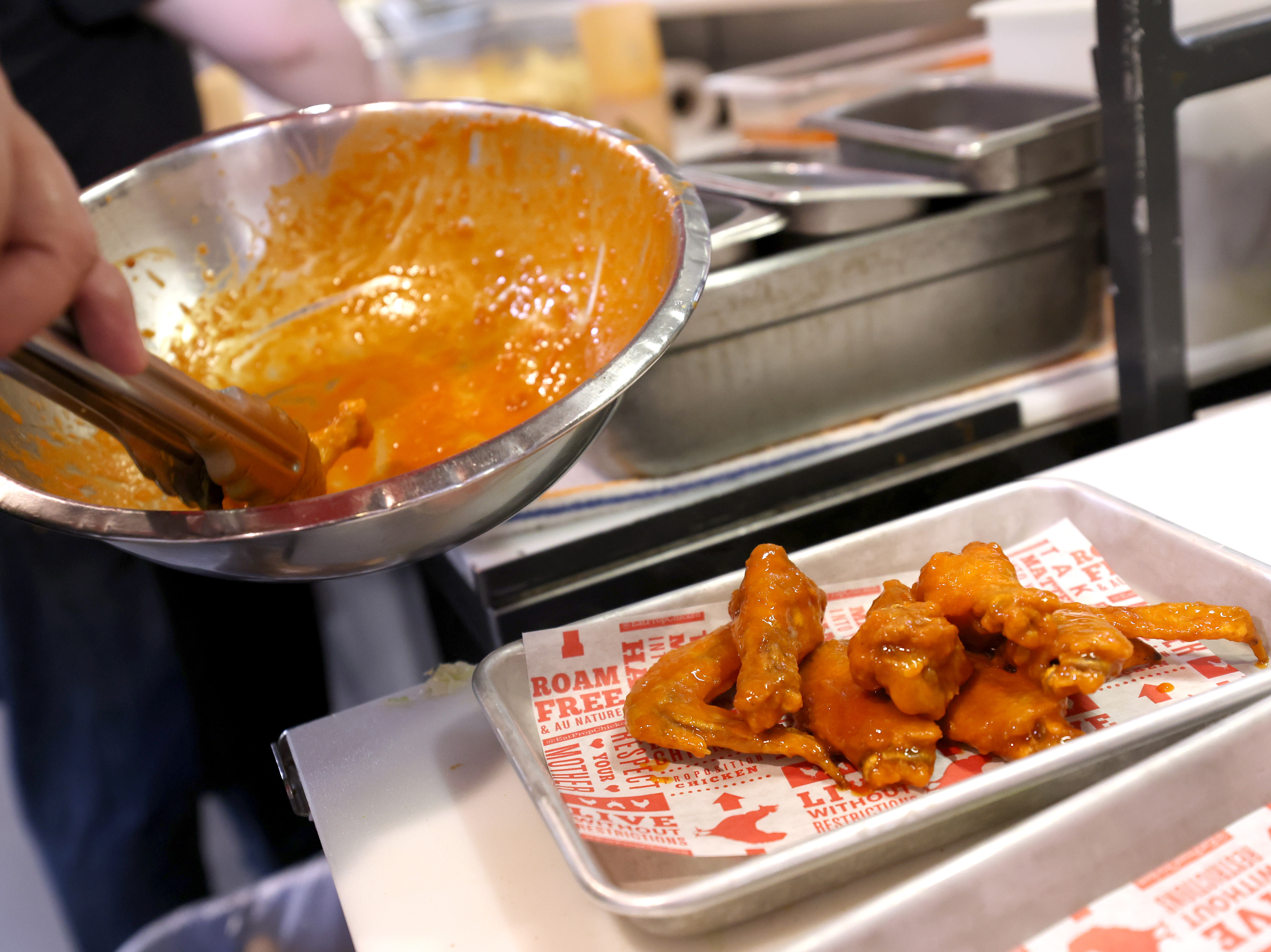 Chicken wing prices have fallen for the second year in a row, in a windfall for Super Bowl snackers. Beef prices, however, are still climbing. (Getty Images)