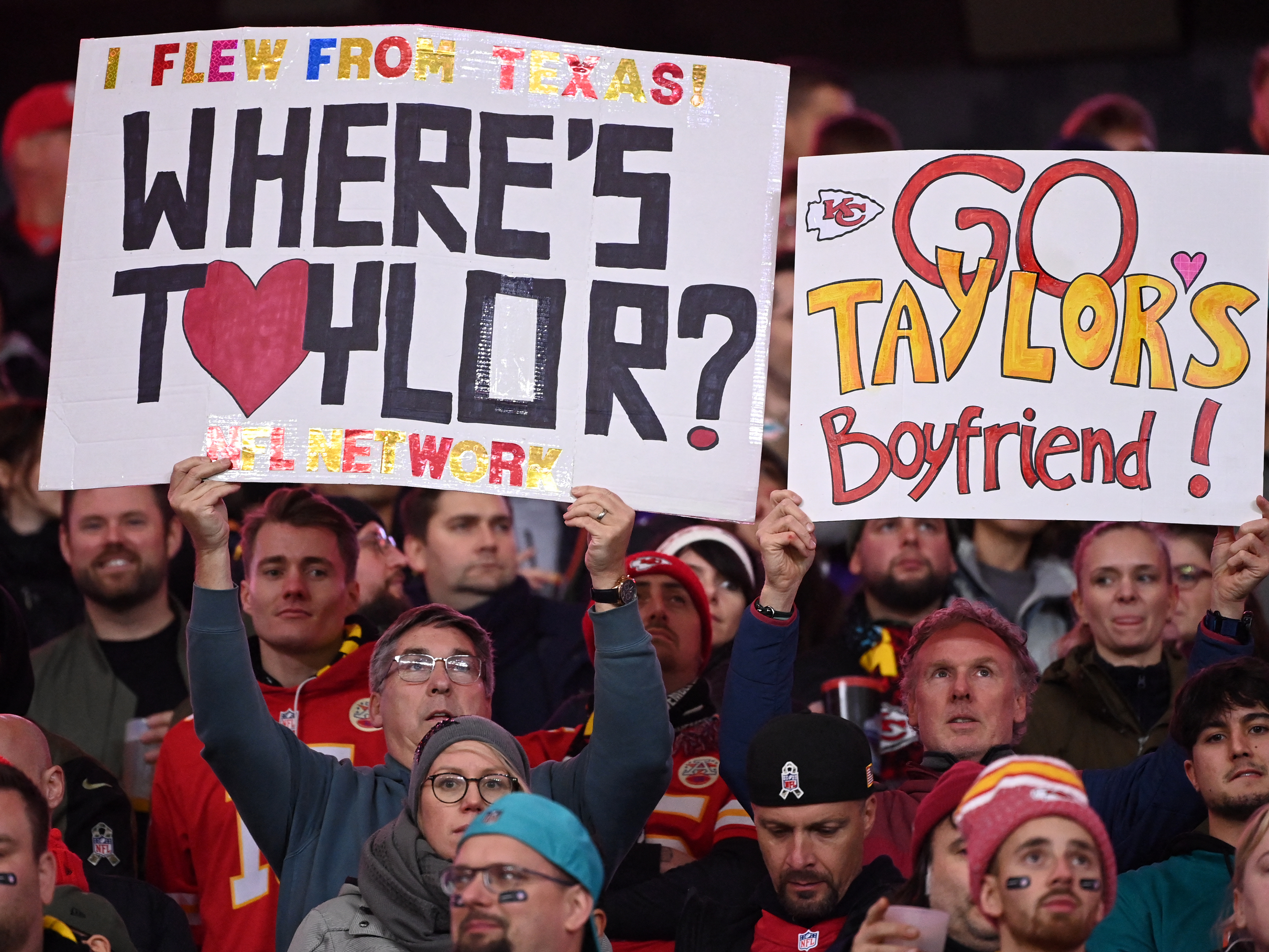Fans hold up signs during the NFL game between Miami Dolphins and Kansas City Chiefs in Germany in November. (AFP via Getty Images)