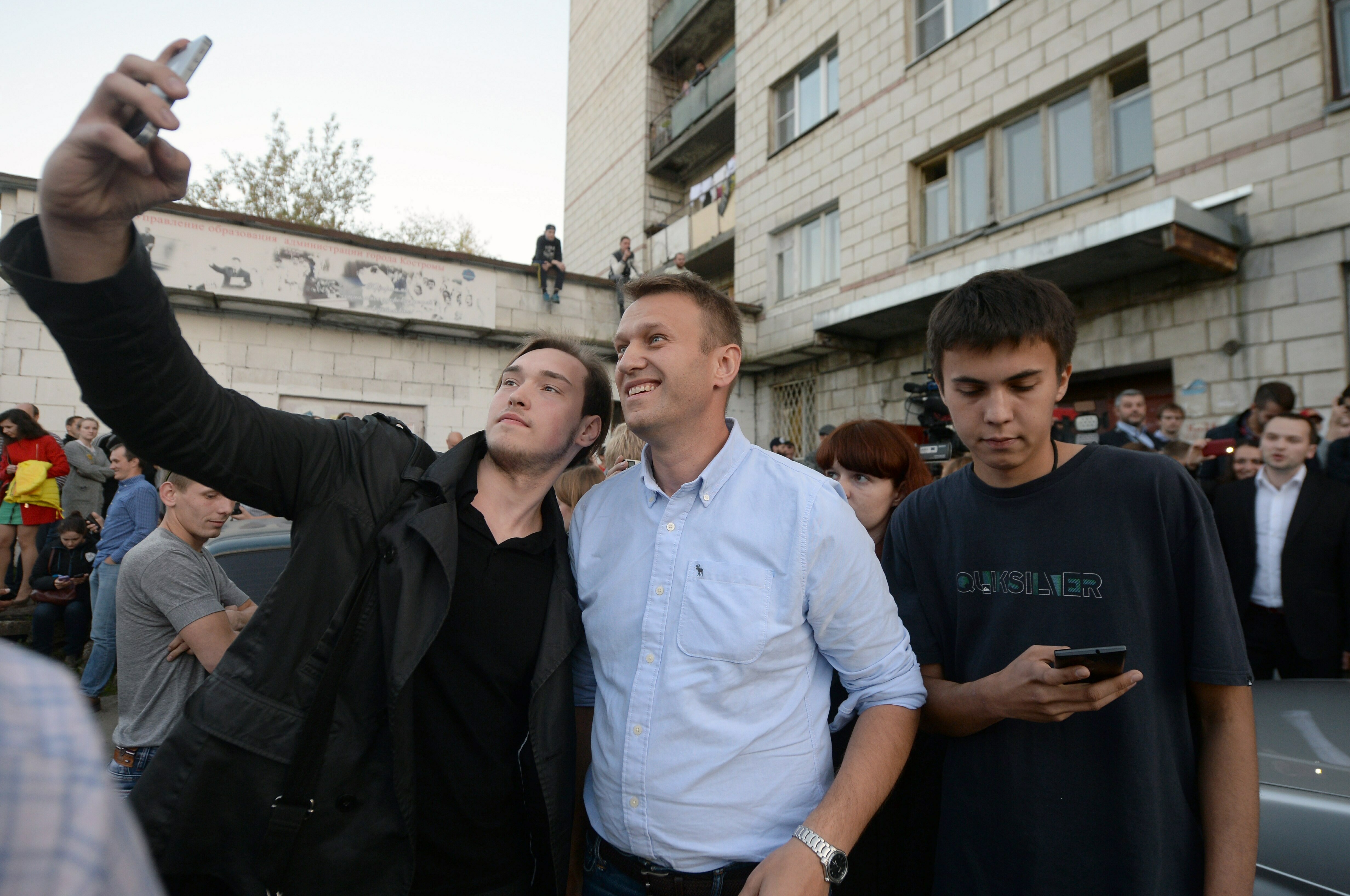 Photos: See Russian anti-corruption leader Alexei Navalny's life in pictures 7 September 13, 2015: A man takes a selfie with Russian opposition leader Alexei Navalny, center, near the Open Russia movement office during Russian regional elections in the town of Kostroma, some 300 km outside Moscow. Russians voted September 13 in a regional election expected to yield few surprises, with the country's liberal opposition only able to field a handful of candidates.