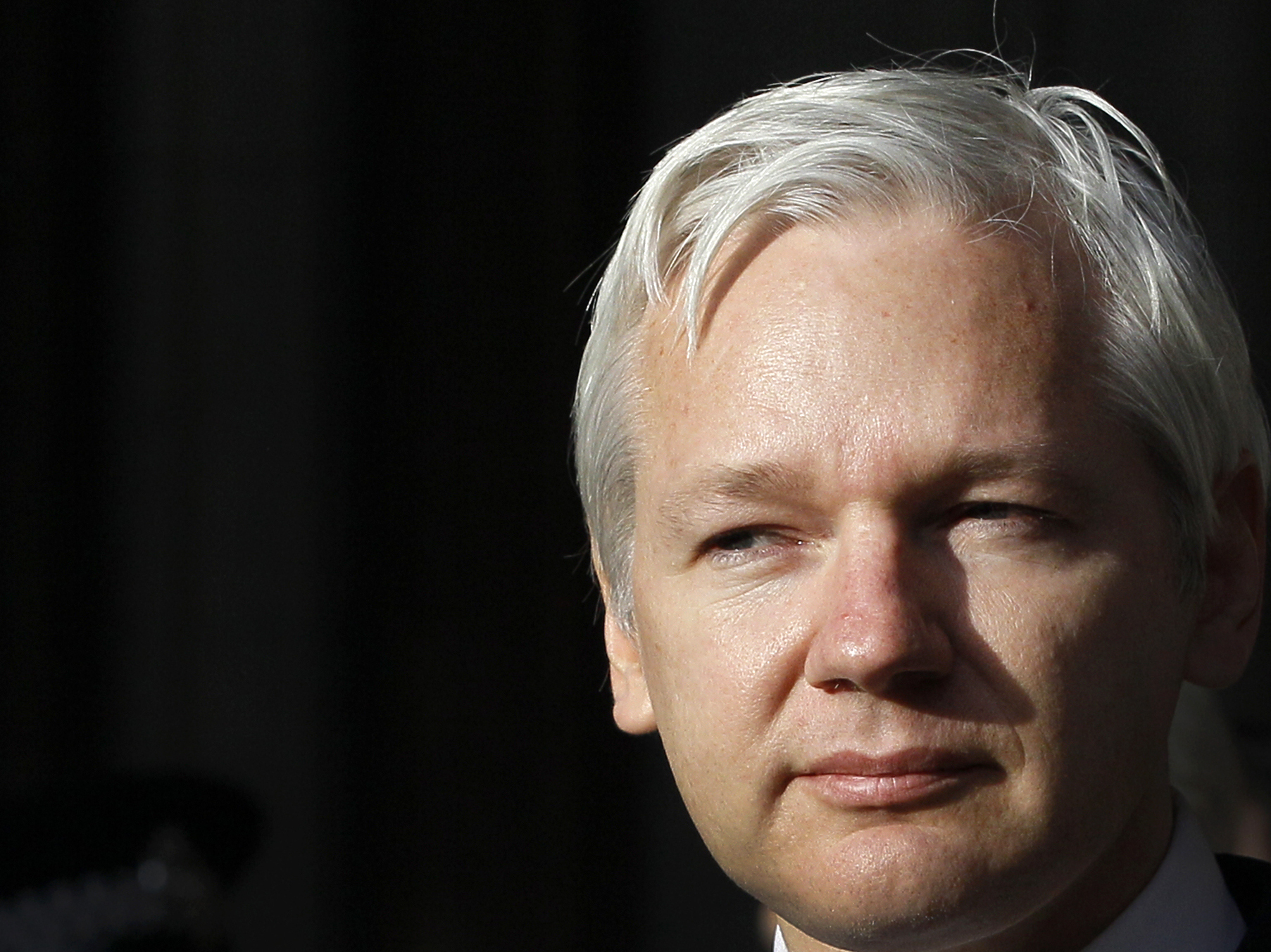 WikiLeaks founder Julian Assange is shown making a statement to the media gathered outside the High Court in London, Dec. 5, 2011.