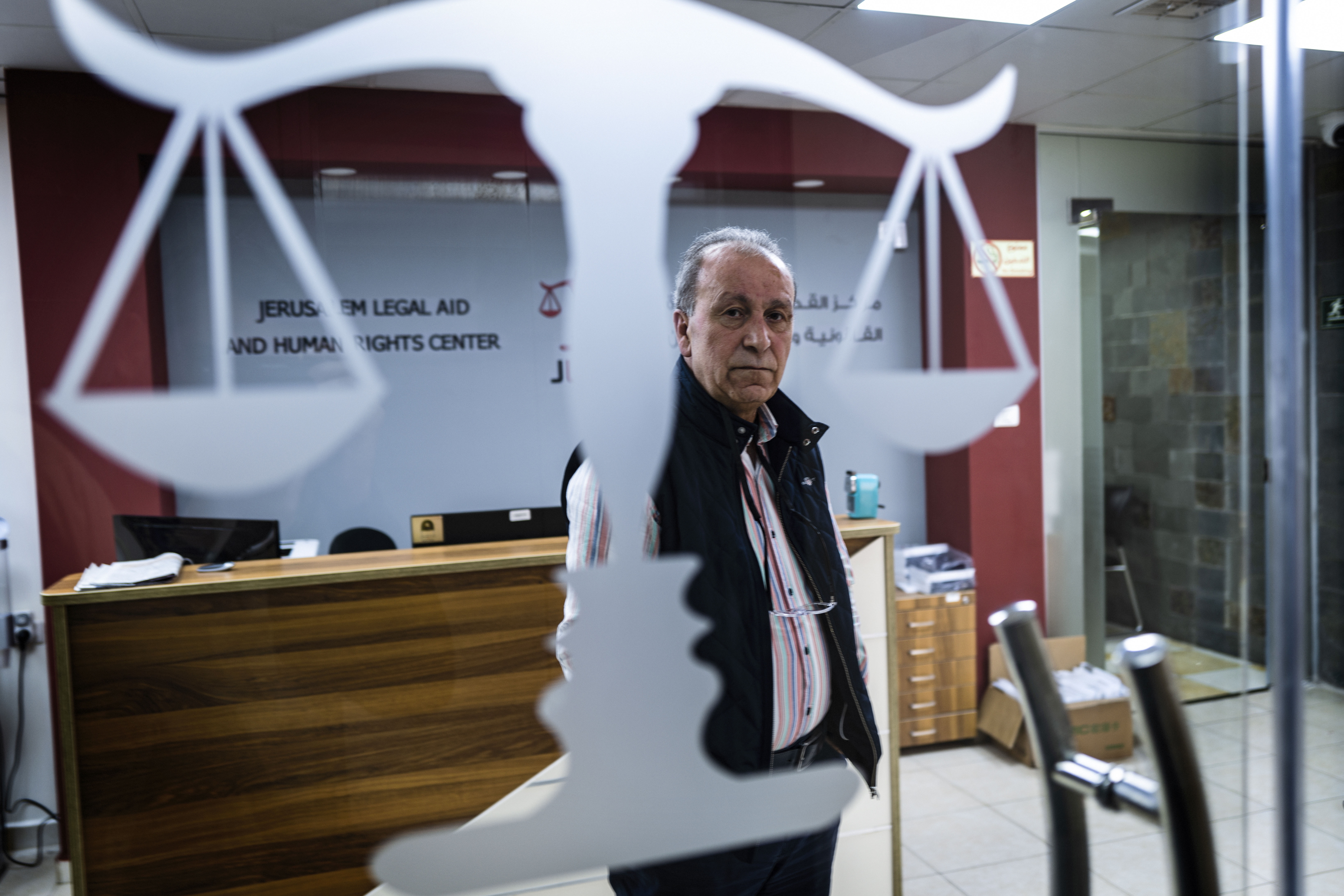 Issam Aruri, a Palestinian who runs the Jerusalem Legal Aid and Human Rights Center, works on cases where Israel is holding the bodies of Palestinians who died while attacking Israel. Both Israel and Hamas hold the bodies of the dead from the other side to use as leverage in negotiations. (Ayman Oghanna for NPR)