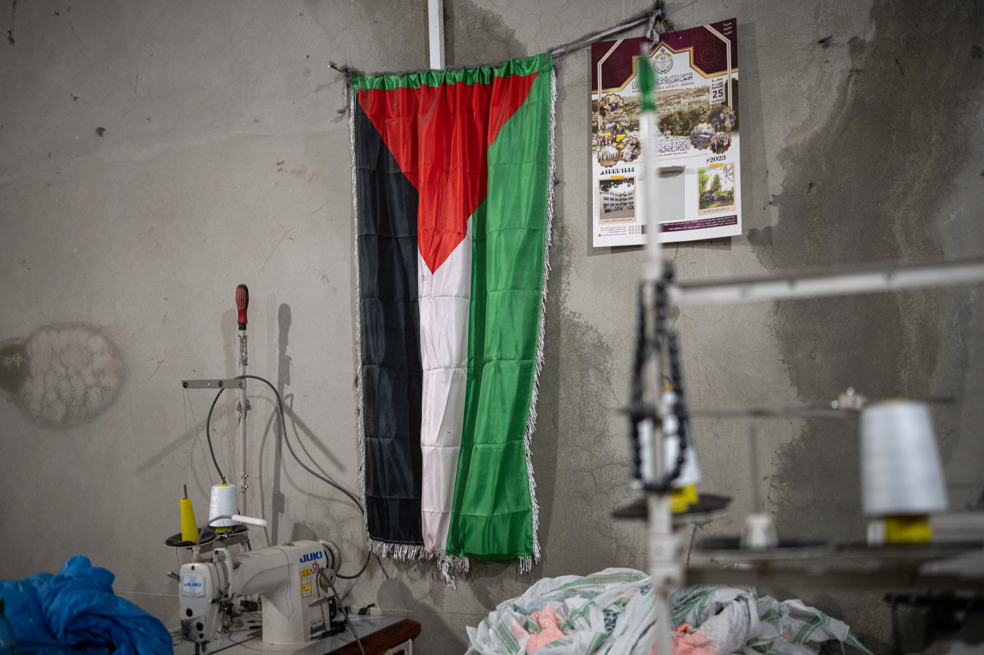One-of-a-kind West Bank factory ships the colors of Palestinian resilience worldwide 3 A Palestinian flag hangs on the wall of the Hirbawi factory.