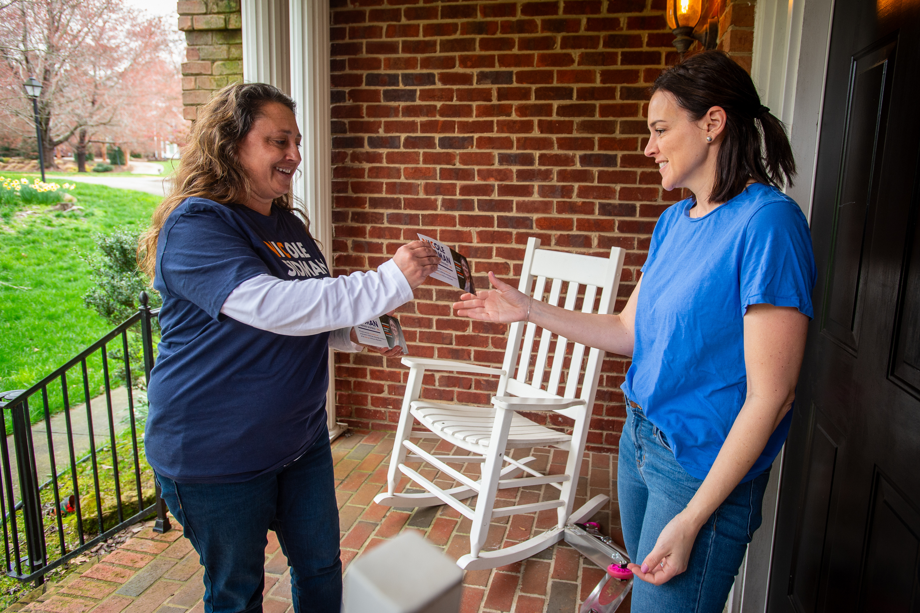 Nicole Sidman talks with prospective voter Rebekah Rubenstein on Sunday in Charlotte, N.C., ahead of Super Tuesday. (Kate Medley for NPR)