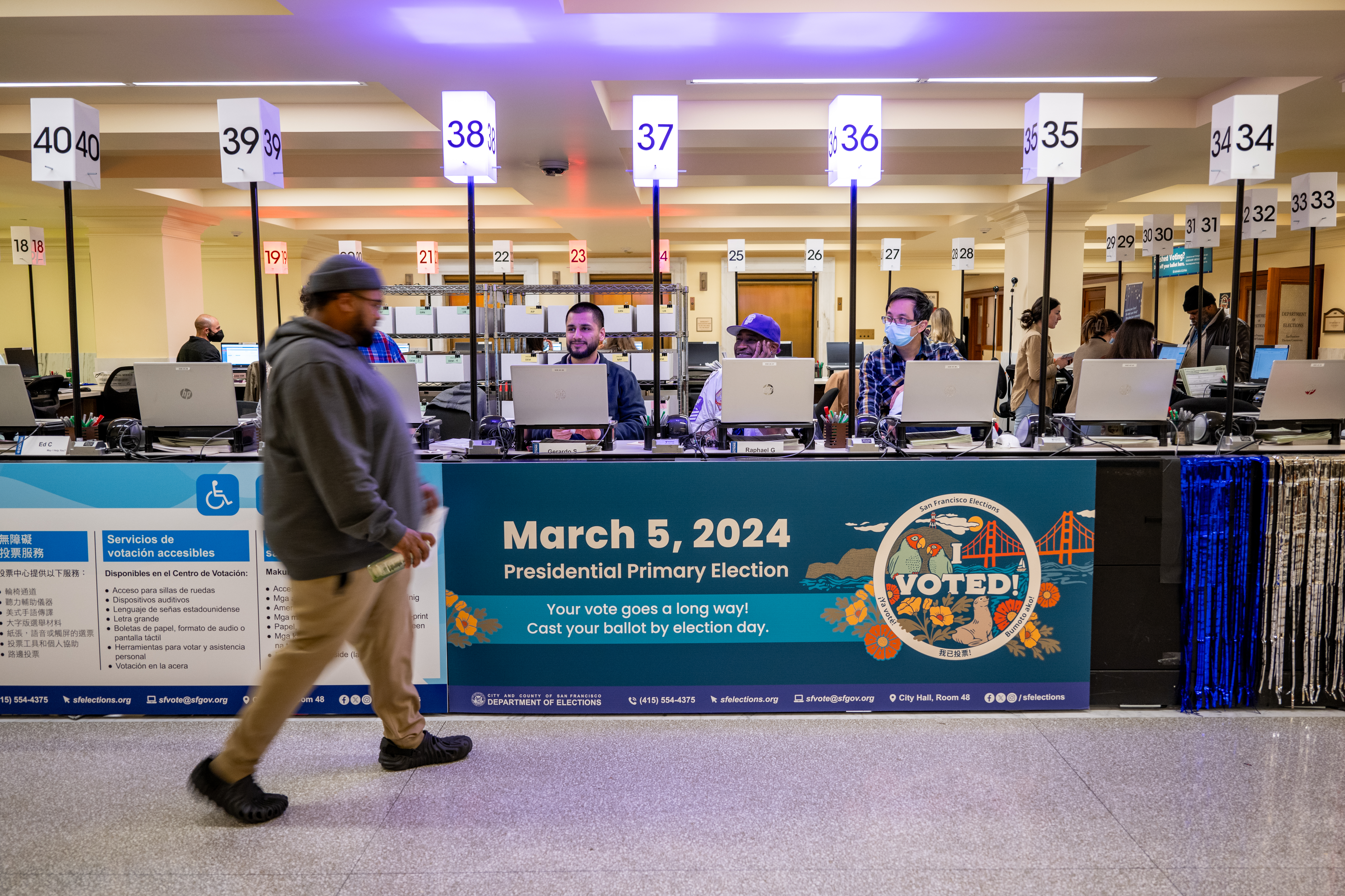 Voters cast their ballots on Super Tuesday at City Hall in San Francisco.