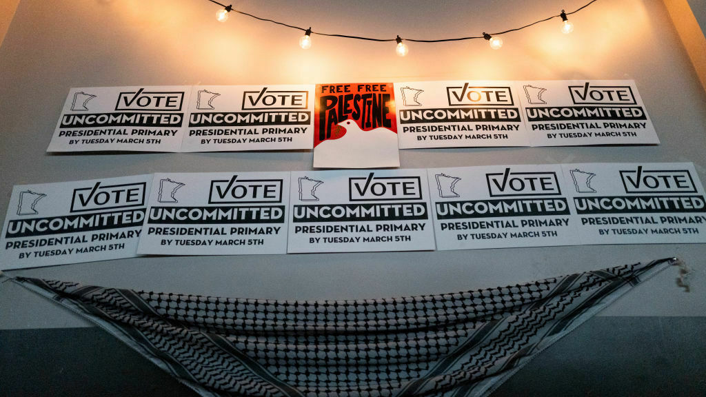 Placards adorn a wall at an Uncommitted Minnesota watch party during the presidential primary in Minneapolis on Super Tuesday. (AFP via Getty Images)