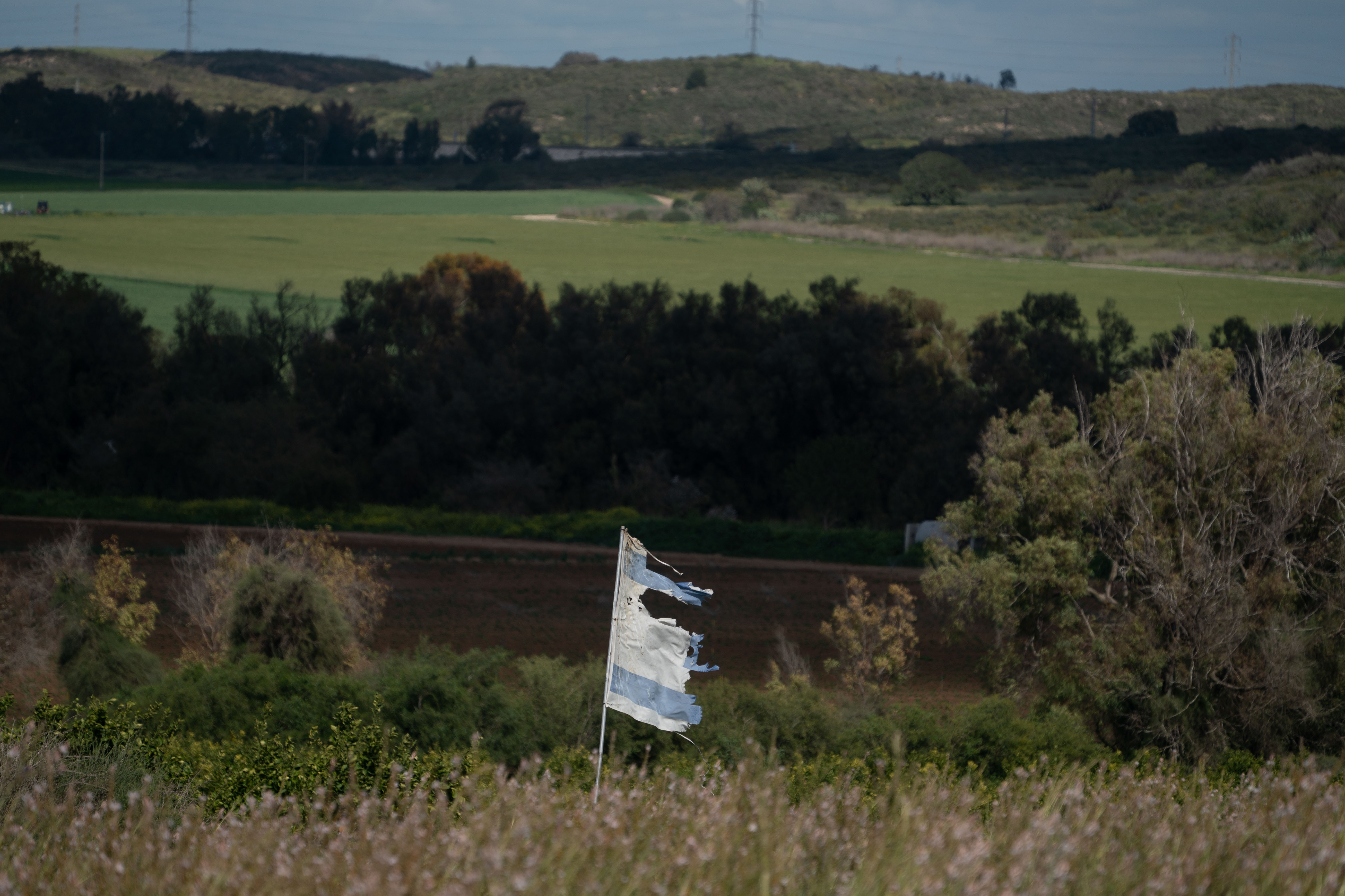 A tattered Israeli flag waves on Israel's southern border with the Gaza Strip on Thursday. (Maya Levin for NPR)