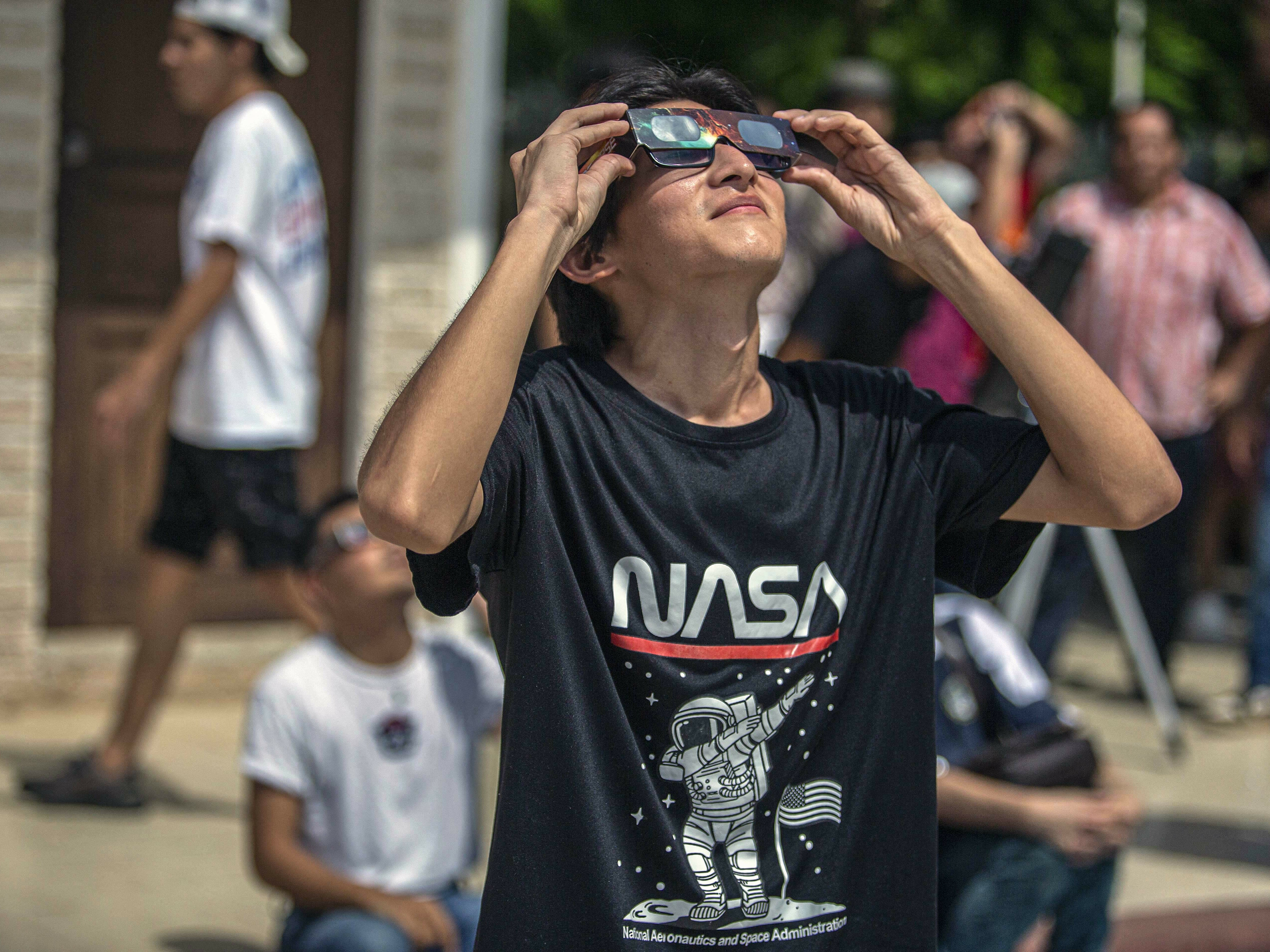 A man watches the annular solar eclipse in Merida, Mexico, last  October. (AFP via Getty Images)