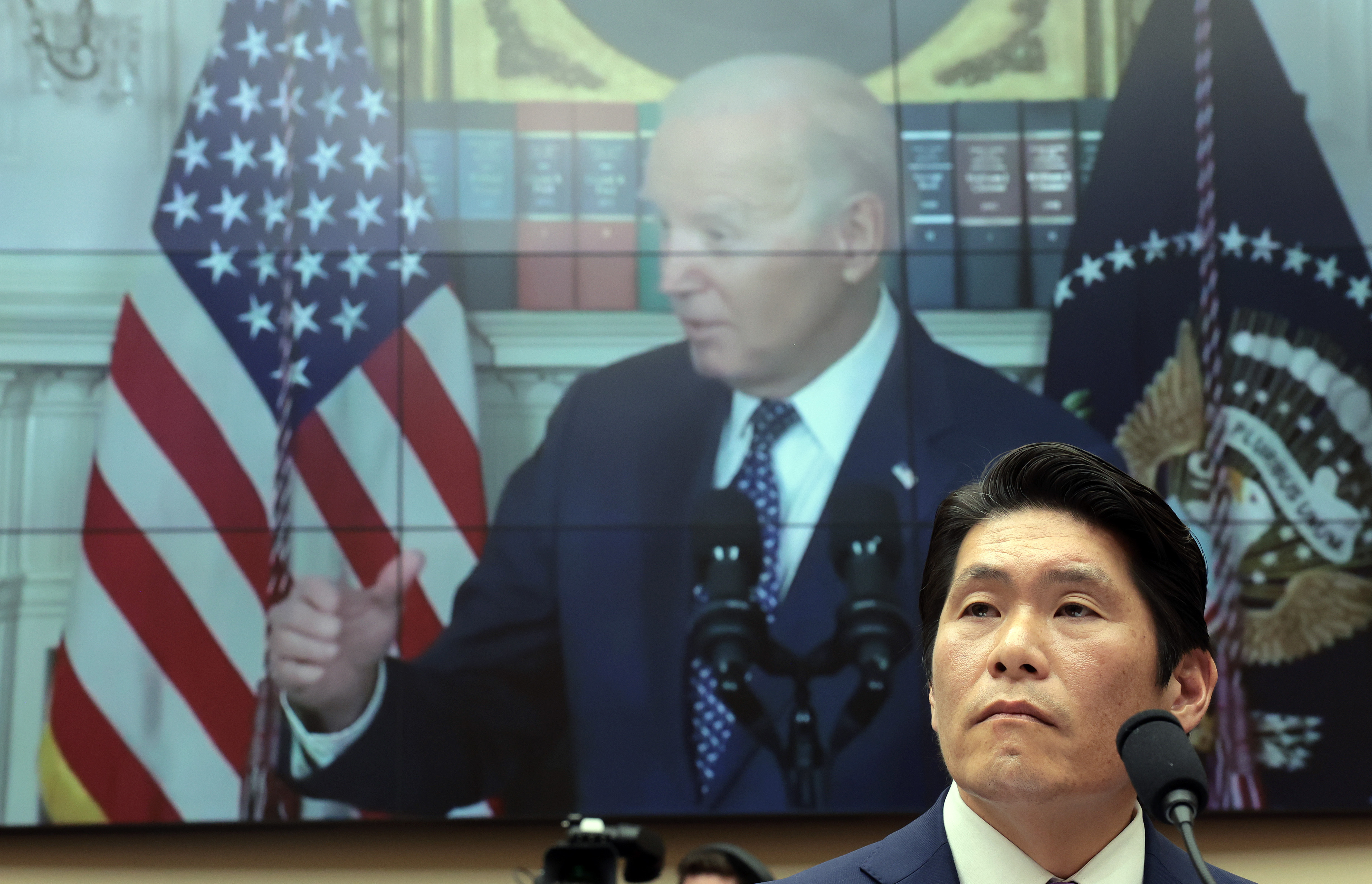 Robert Hur, the special counsel who led an investigation into President Biden's handling of classified documents, testifies alongside video of Biden to the House Judiciary Committee on Tuesday in Washington, D.C. (Getty Images)