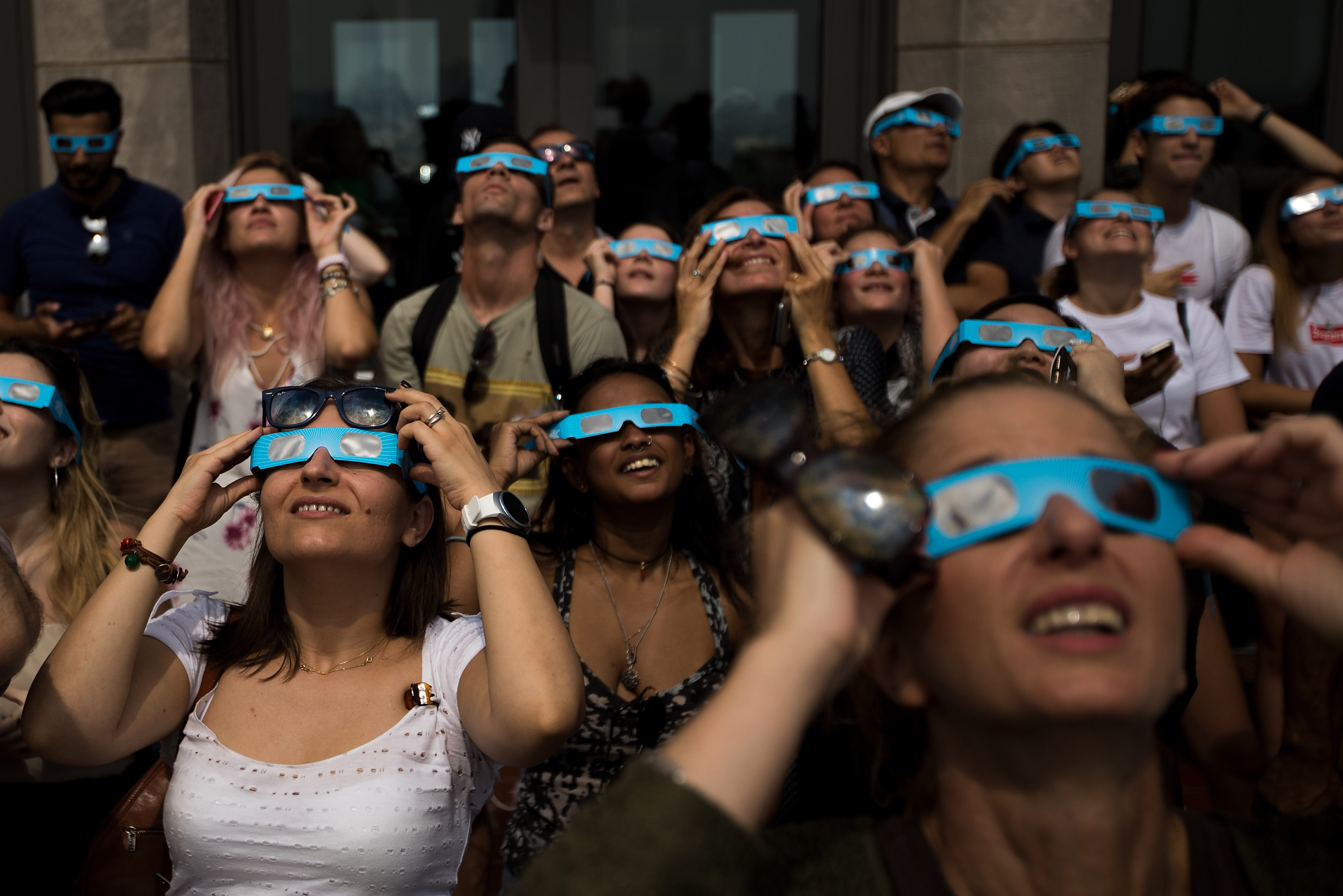 People view a total solar eclipse at from the observatory at Rockefeller Center in New York City on Aug. 21, 2017. (Getty Images)