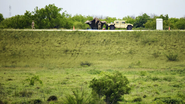 A truck on a green field. 