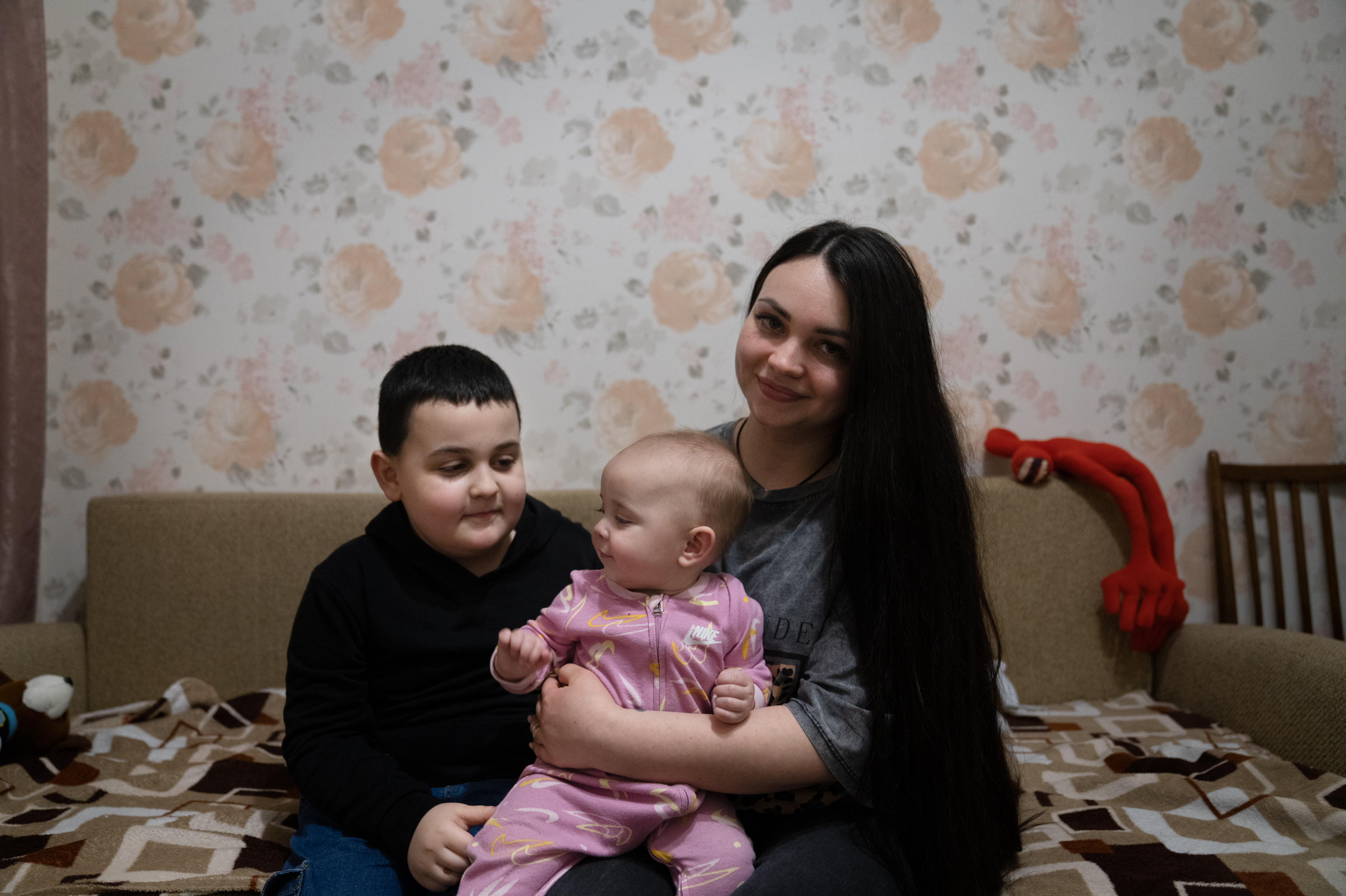 Ukraine's Kharkiv moves classrooms underground so kids survive Russian attacks 3 Maksym sits with his mother, Anna Timchenko, and his baby sister, Sonia, at their home.