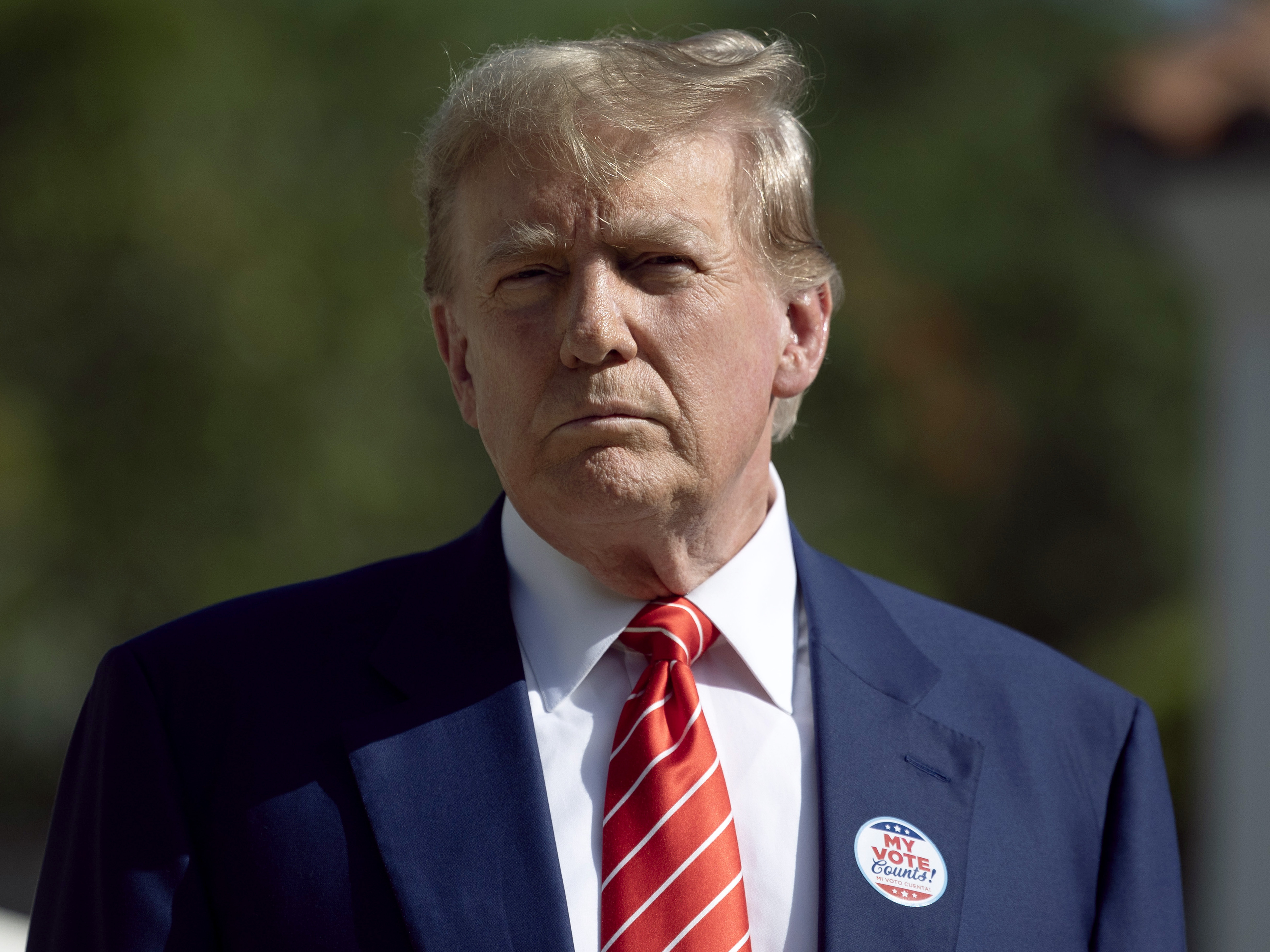 Former U.S. President Donald Trump speaks to the media after voting in the Florida Republican primary at a polling station setup in the Morton and Barbara Mandel Recreation Center on March 19, 2024, in Palm Beach, Florida. (Getty Images)