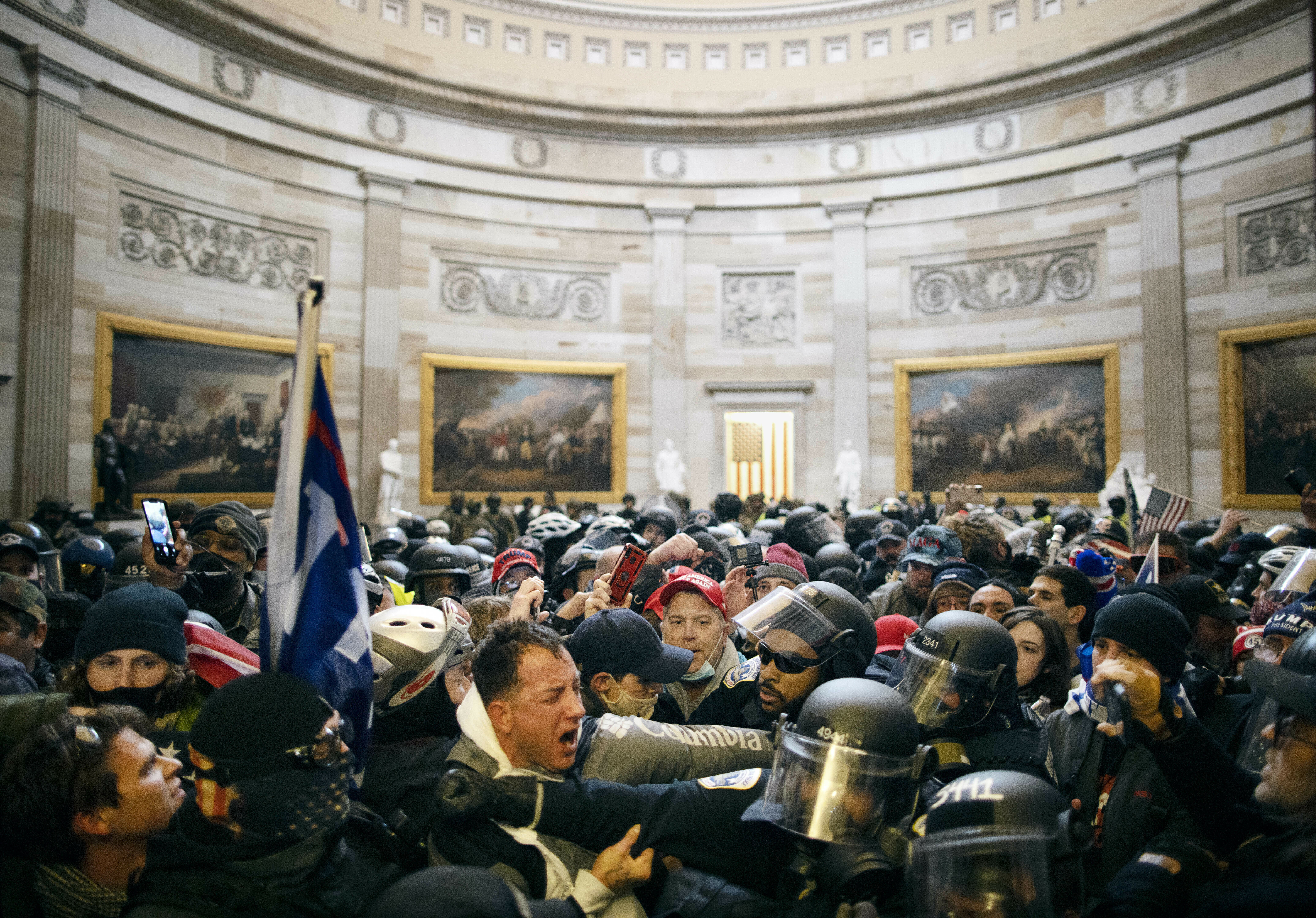 Police clash with supporters of President Donald Trump who breached security and entered the Capitol building in Washington, D.C., on Jan. 6, 2021. (Anadolu Agency via Getty Images)