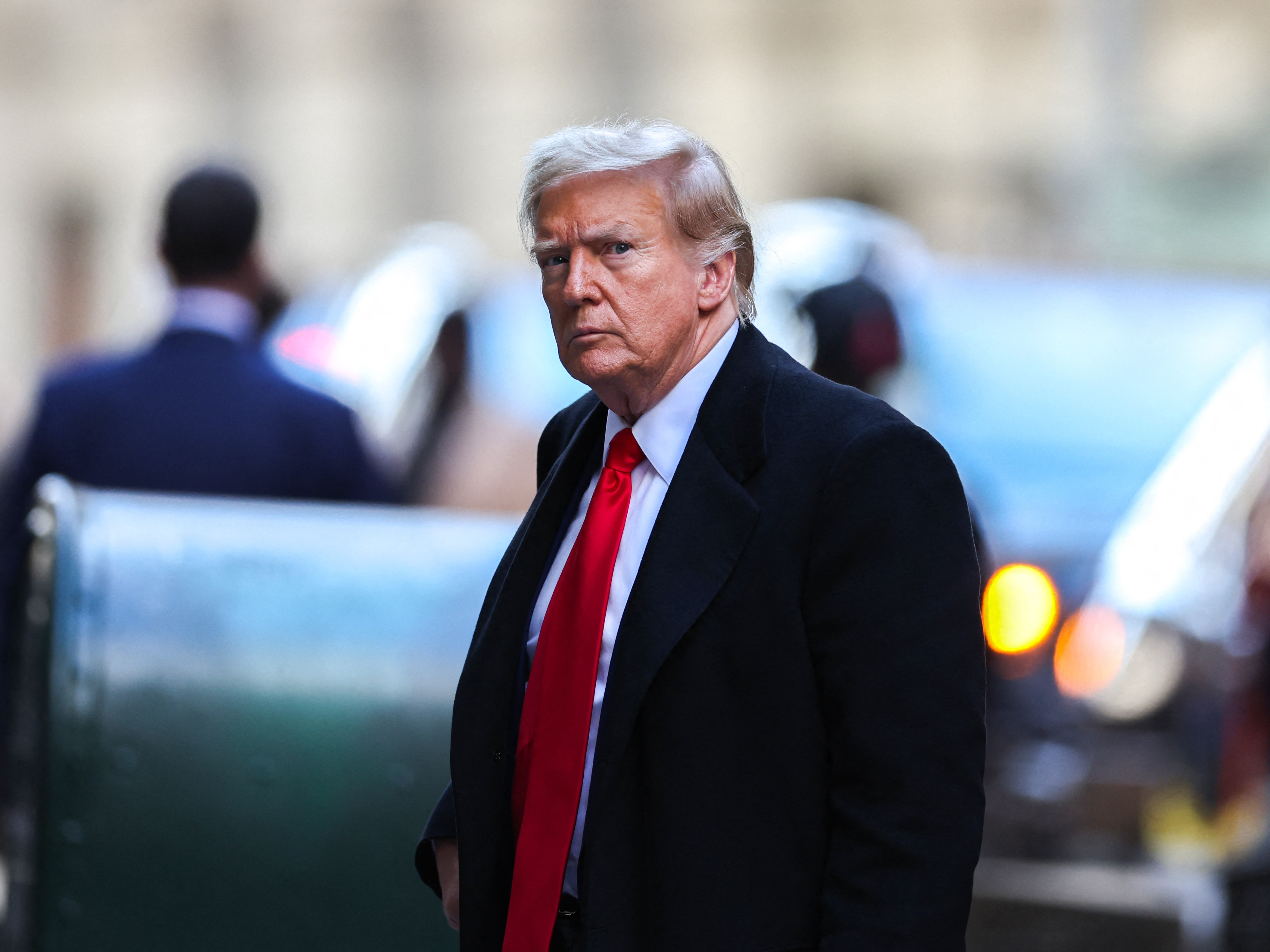 Former US President Donald Trump arrives at 40 Wall Street after his court hearing to determine the date of his trial for allegedly covering up hush money payments linked to extramarital affairs. (AFP via Getty Images)