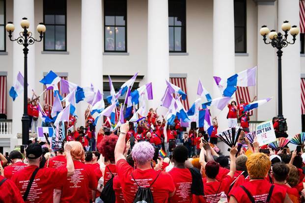 Advocates outside Florida's historic Capitol wave drag pride flags during the Drag Queens March in 2023. (Erich Martin)