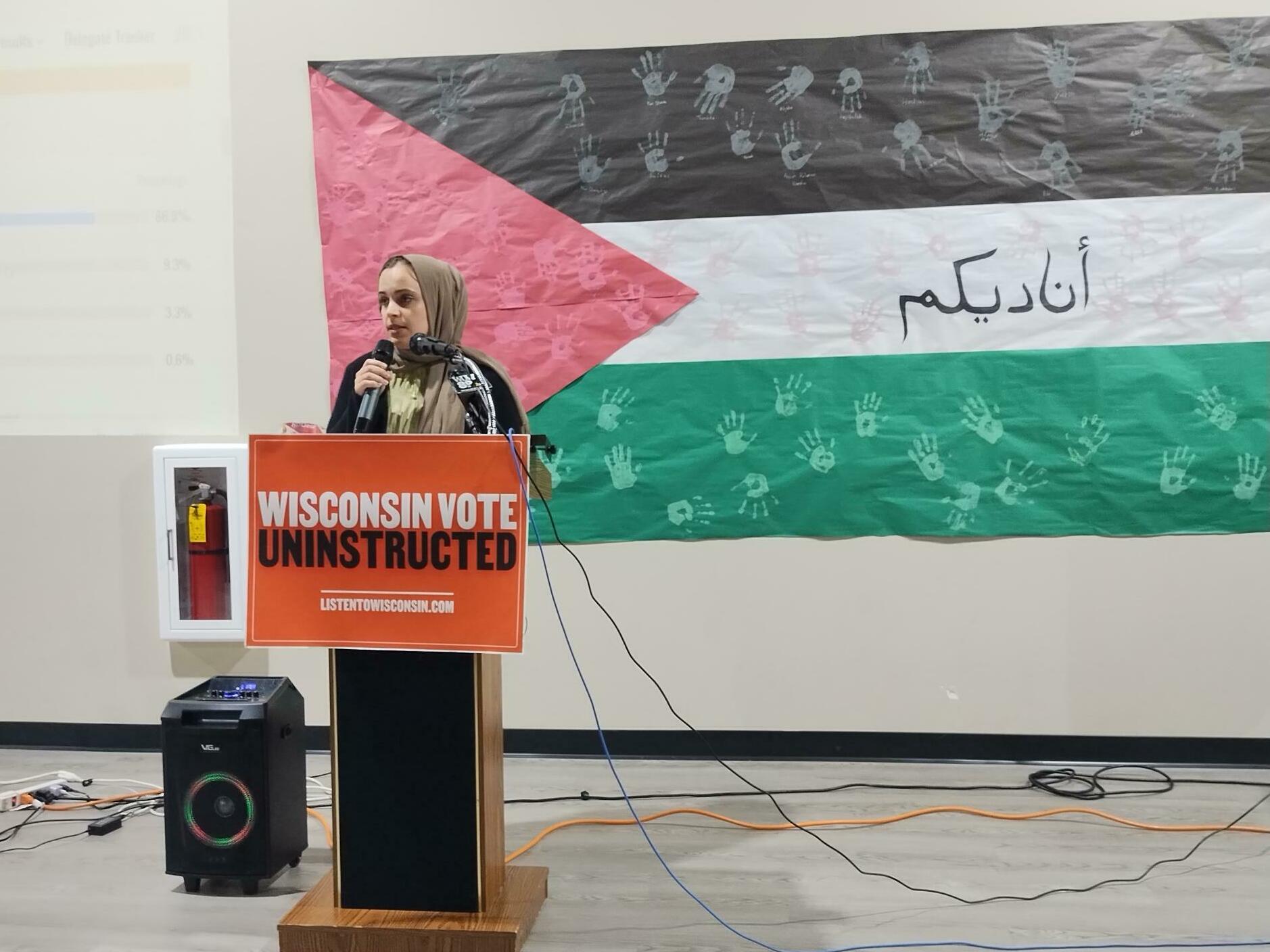 Halah Ahmad of Listen to Wisconsin speaks to supporters of the &quot;uninstructed&quot; movement in Milwaukee on Tuesday evening after polls closed in Wisconsin's presidential primary. (WUWM)