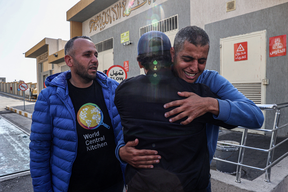 Relatives and friends mourn the death of Saifeddin Issam Ayad Abutaha, a member of the U.S.-based aid group World Central Kitchen who was killed as Israeli strikes hit its convoy delivering food in Gaza, during his funeral in Rafah, in the southern Gaza Strip, on Tuesday. (AFP via Getty Images)